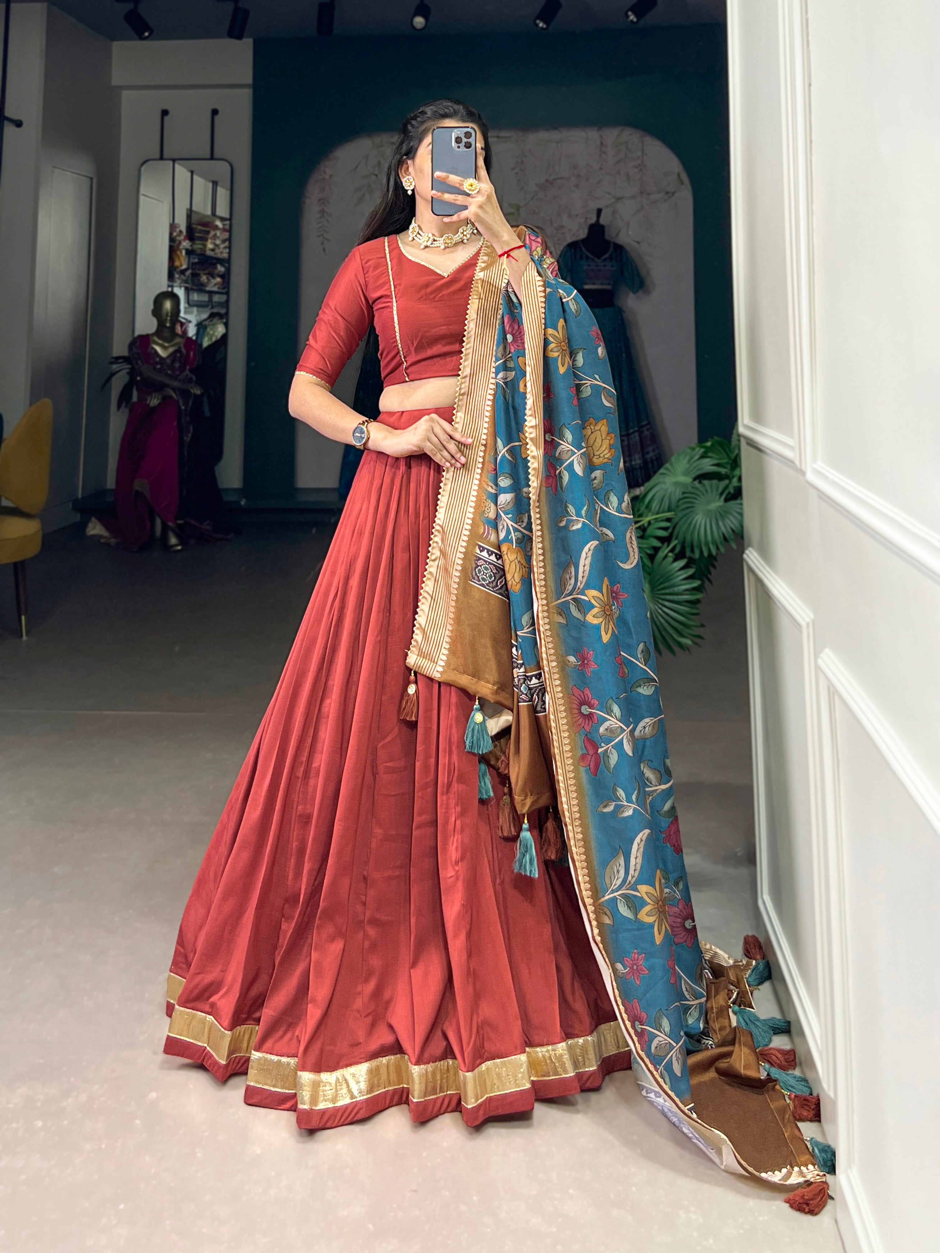 Rust Red Silk Lehenga with Golden Border and Contrasting Blue Floral Dupatta