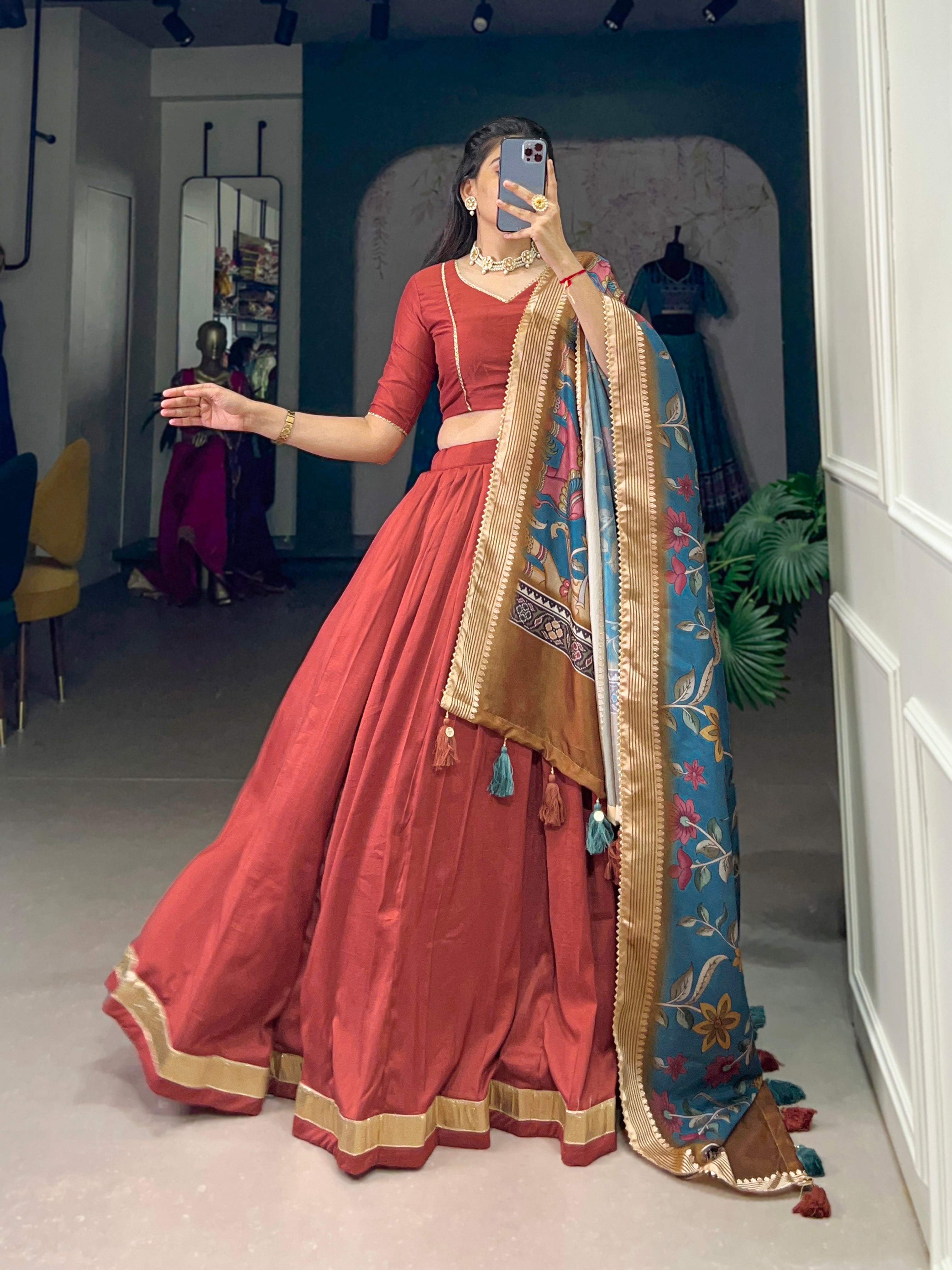 Rust Red Silk Lehenga with Golden Border and Contrasting Blue Floral Dupatta