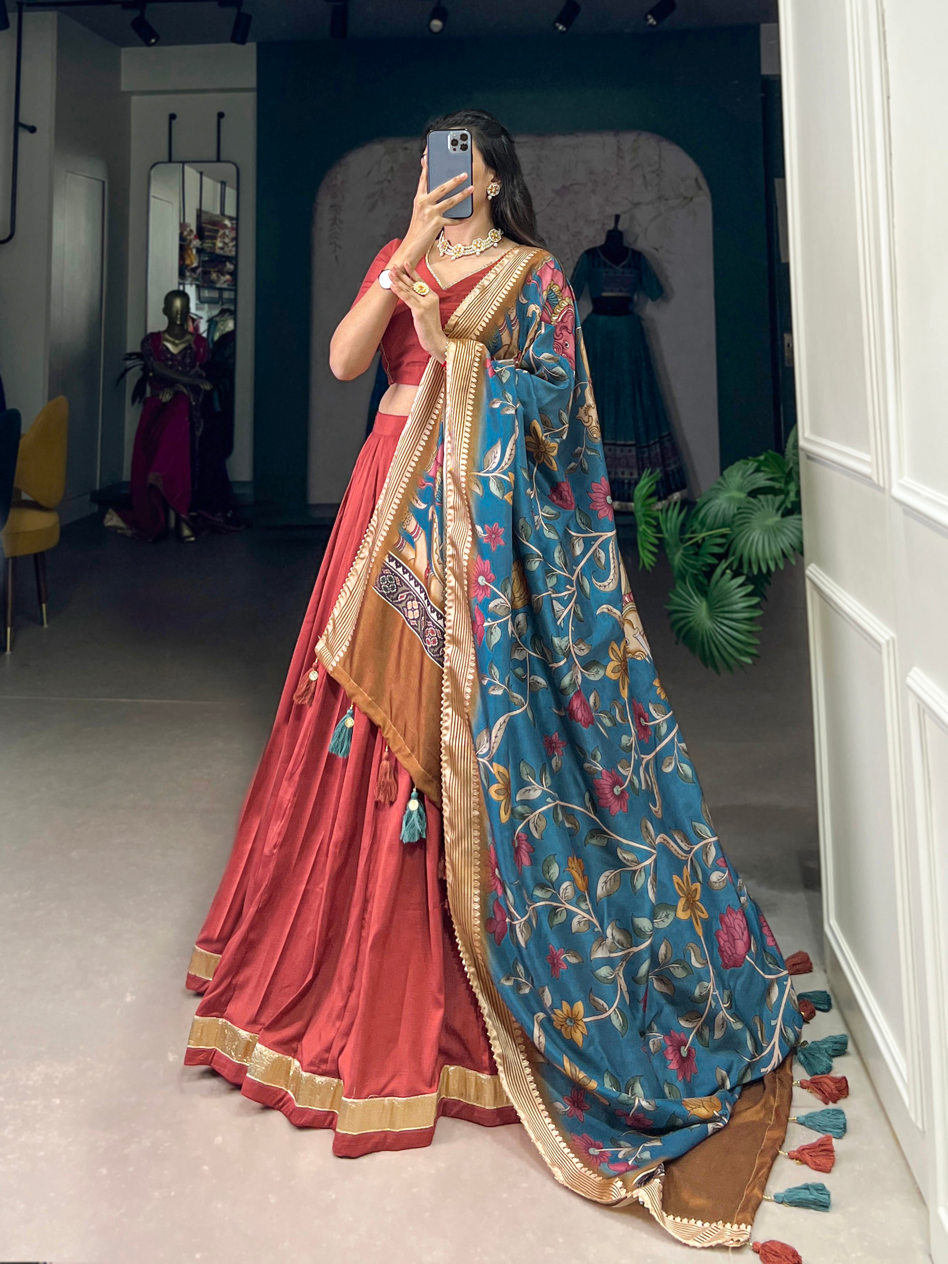 Rust Red Silk Lehenga with Golden Border and Contrasting Blue Floral Dupatta