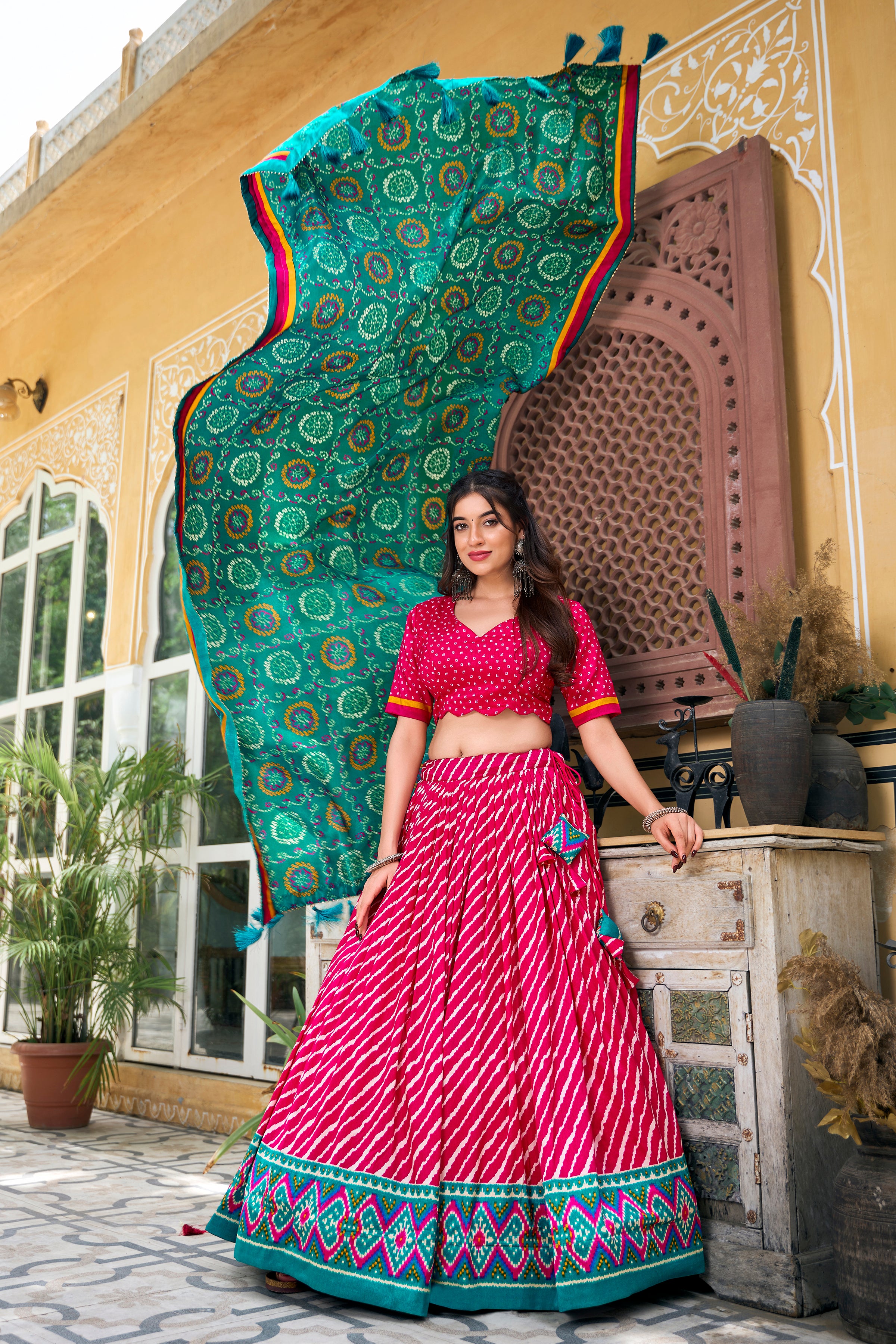Vibrant Pink Bandhej Lehenga with Contrast Teal Dupatta