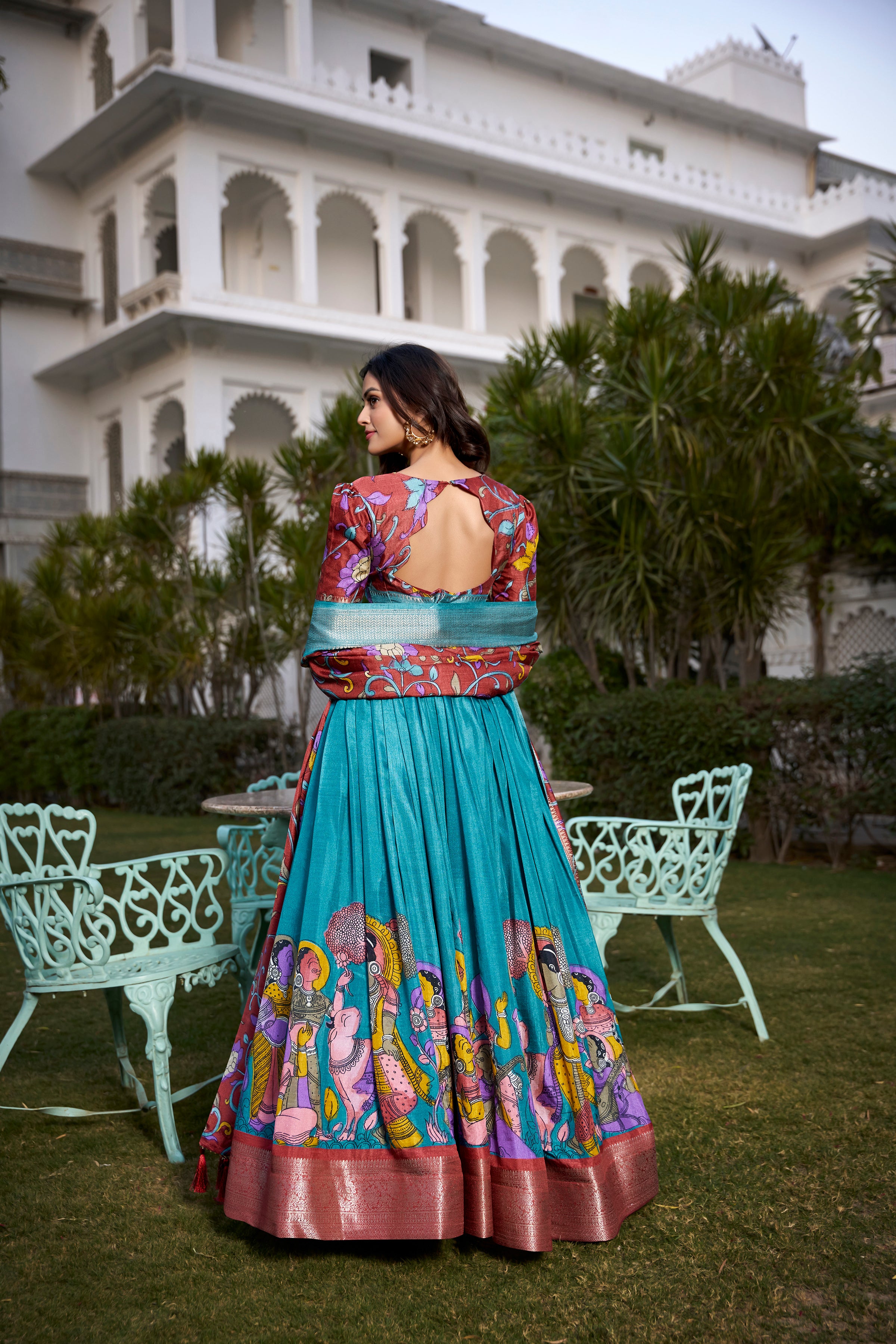 Turquoise and Artistic Print Lehenga with Copper Zari Border