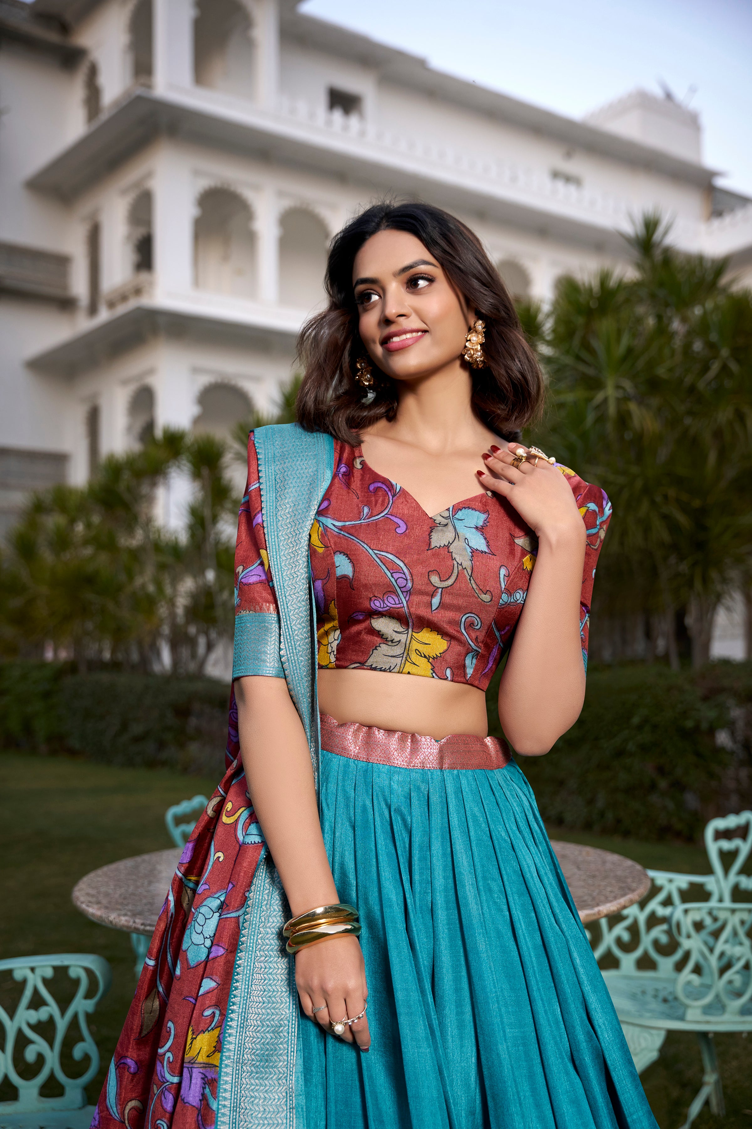 Turquoise and Artistic Print Lehenga with Copper Zari Border