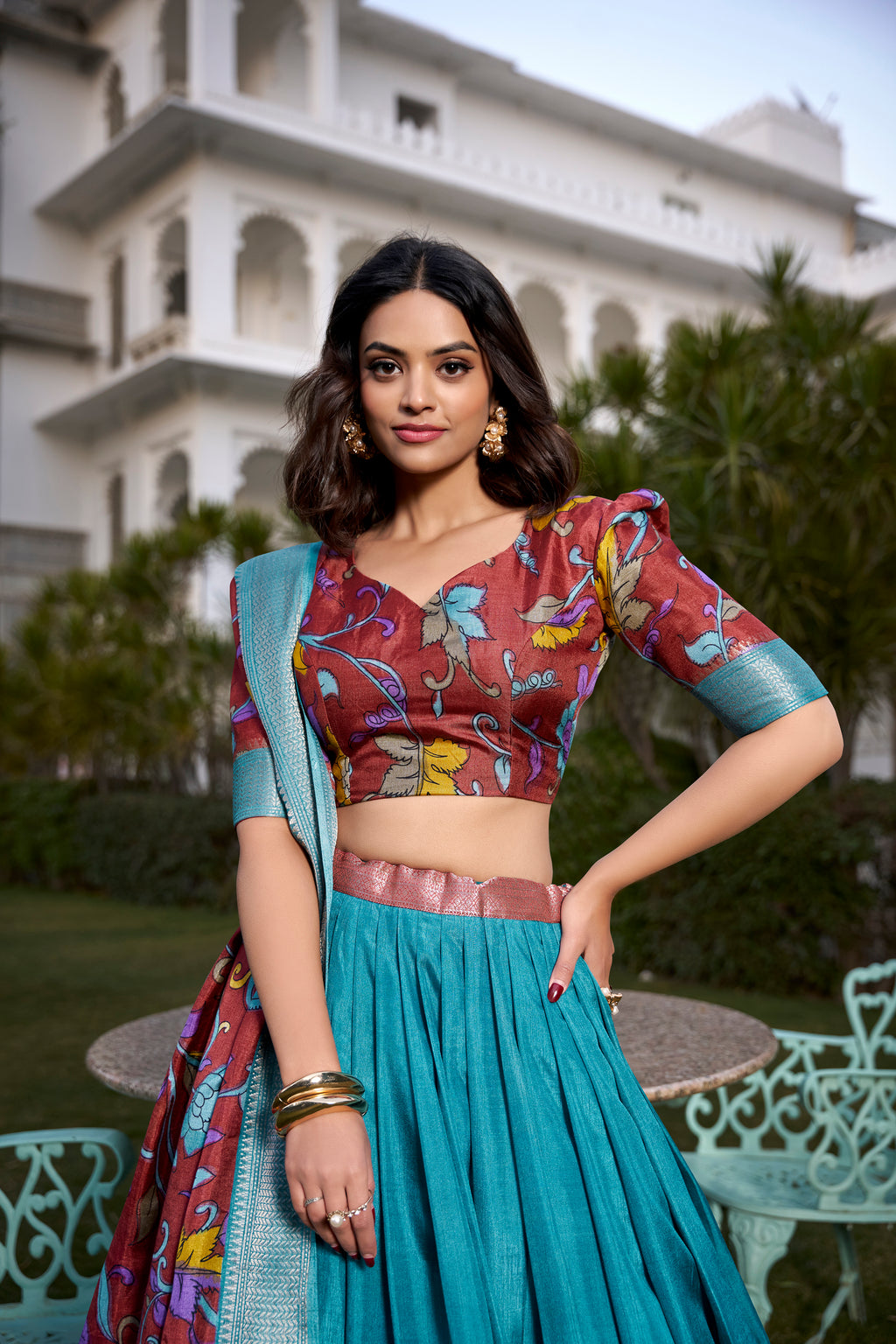 Turquoise and Artistic Print Lehenga with Copper Zari Border