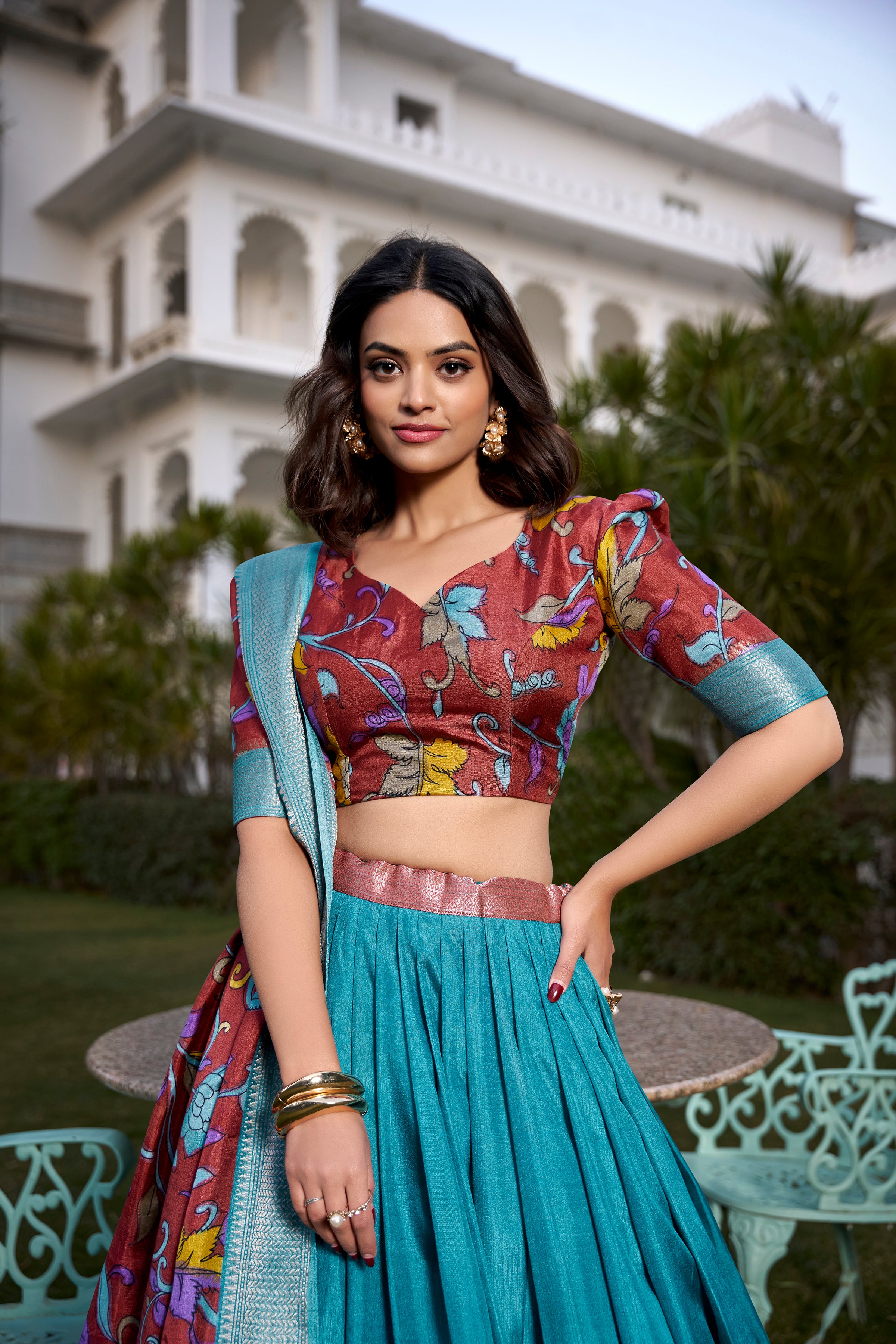 Turquoise and Artistic Print Lehenga with Copper Zari Border