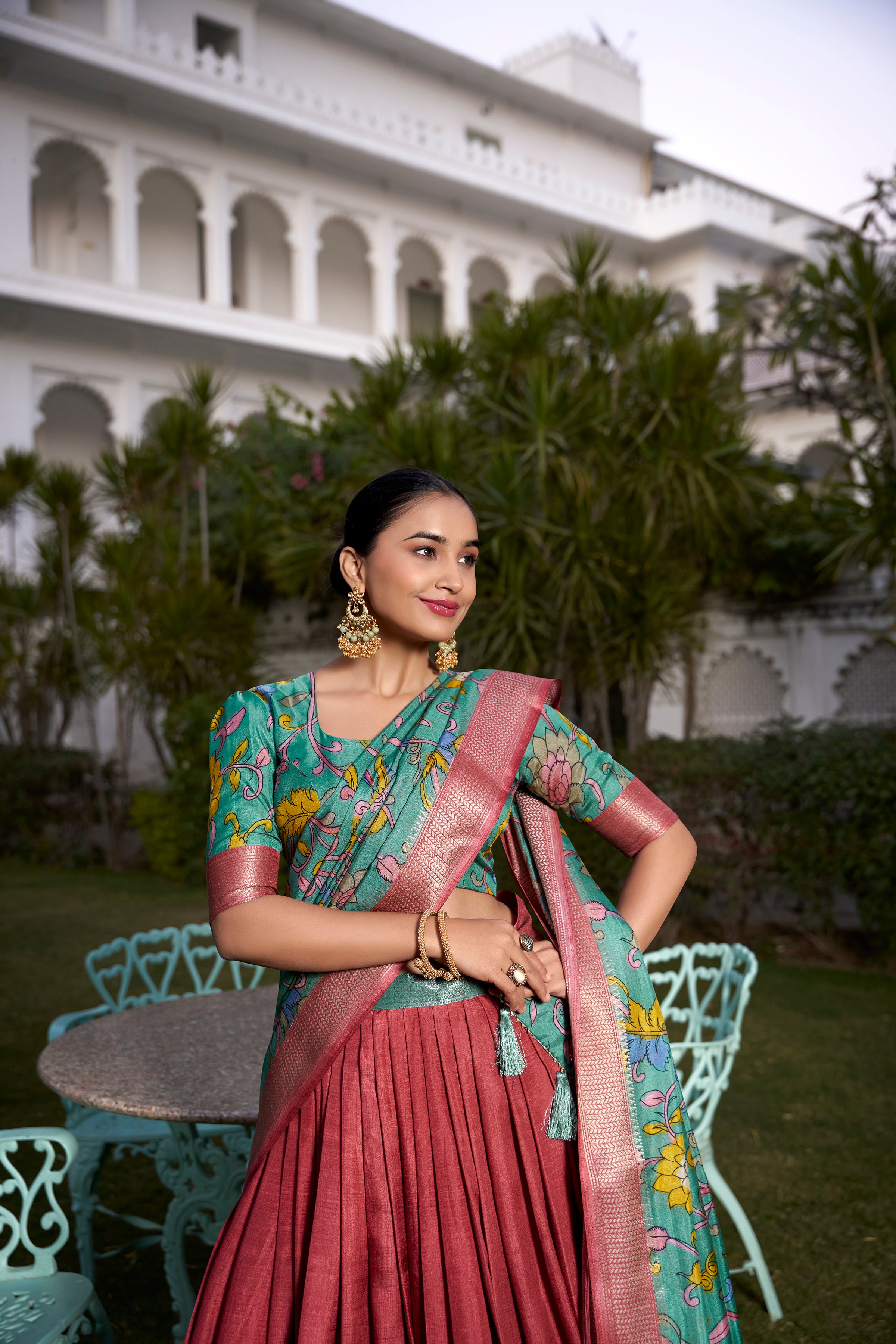 Turquoise and Artistic Print Lehenga with Copper Zari Border