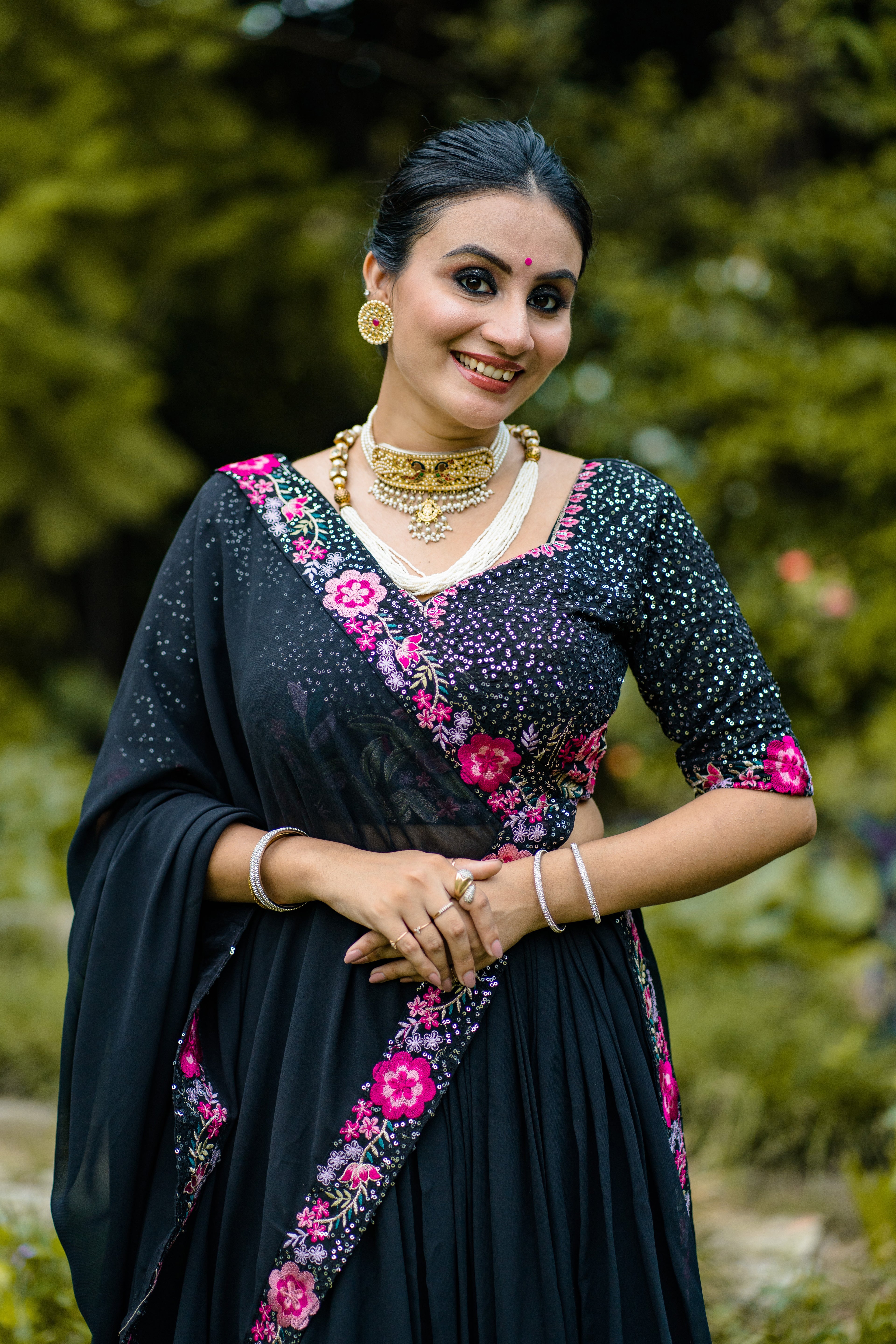 Elegant Black Lehenga Choli with Rani Pink Floral Embroidery