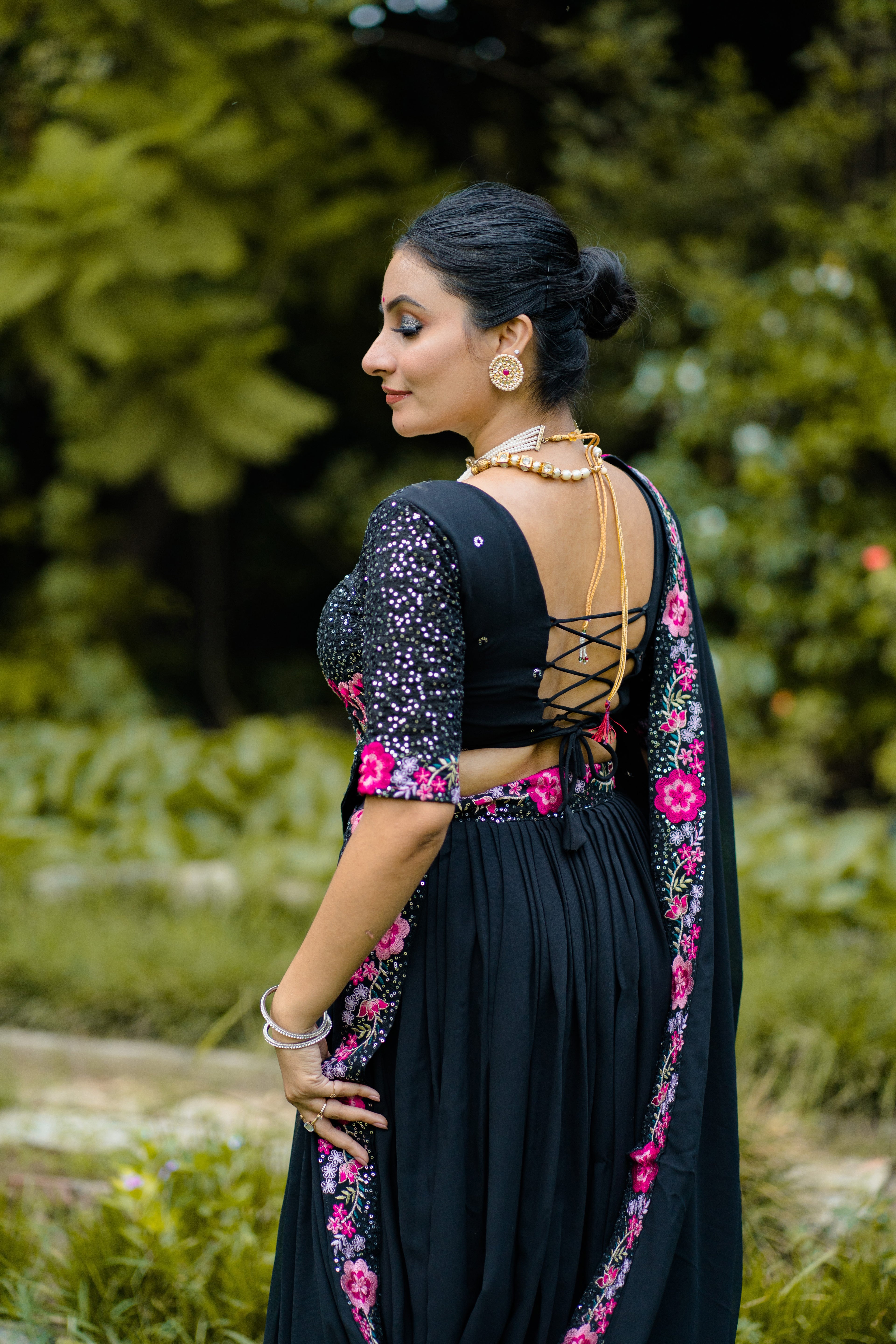 Elegant Black Lehenga Choli with Rani Pink Floral Embroidery