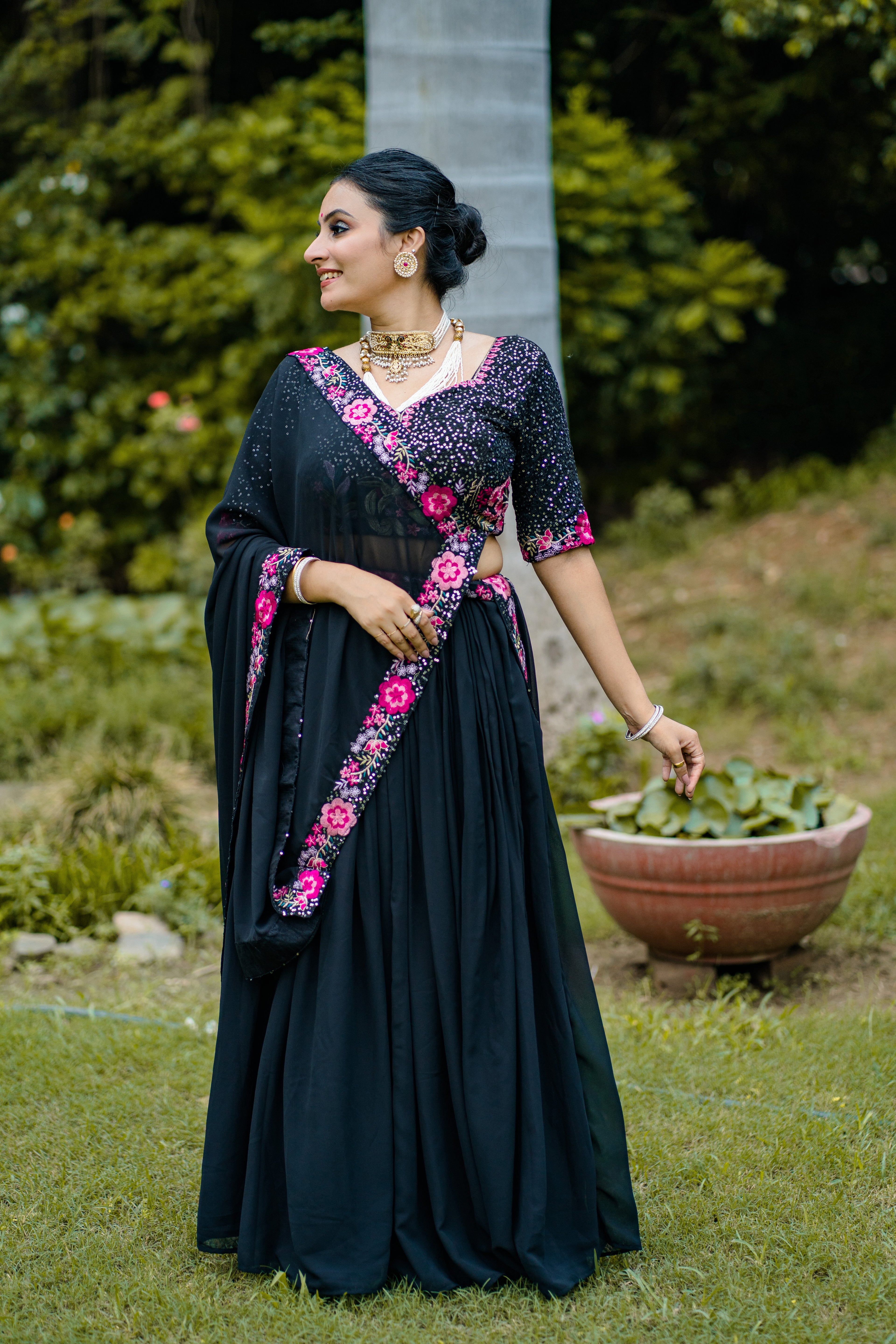 Elegant Black Lehenga Choli with Rani Pink Floral Embroidery