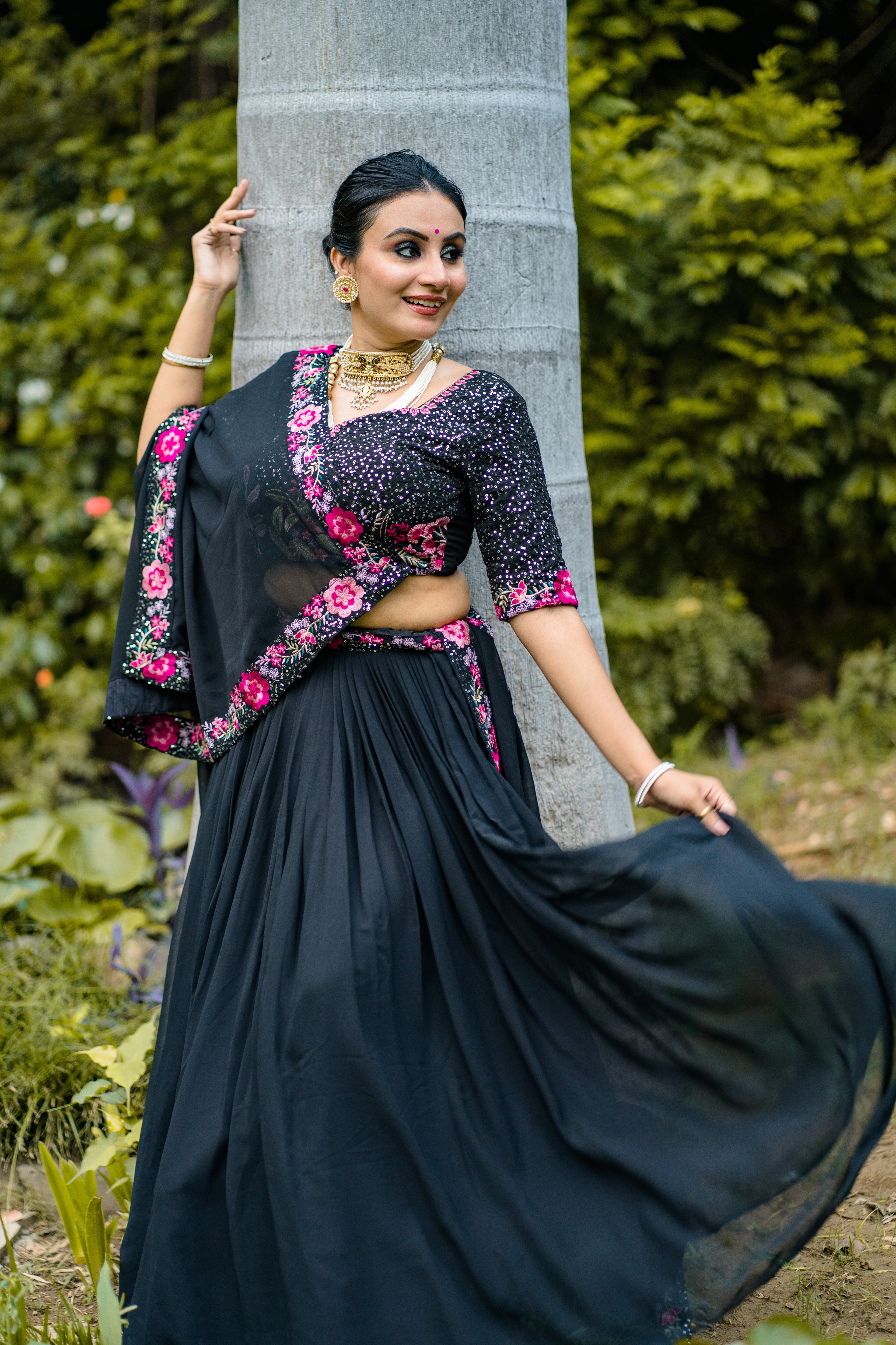 Elegant Black Lehenga Choli with Rani Pink Floral Embroidery