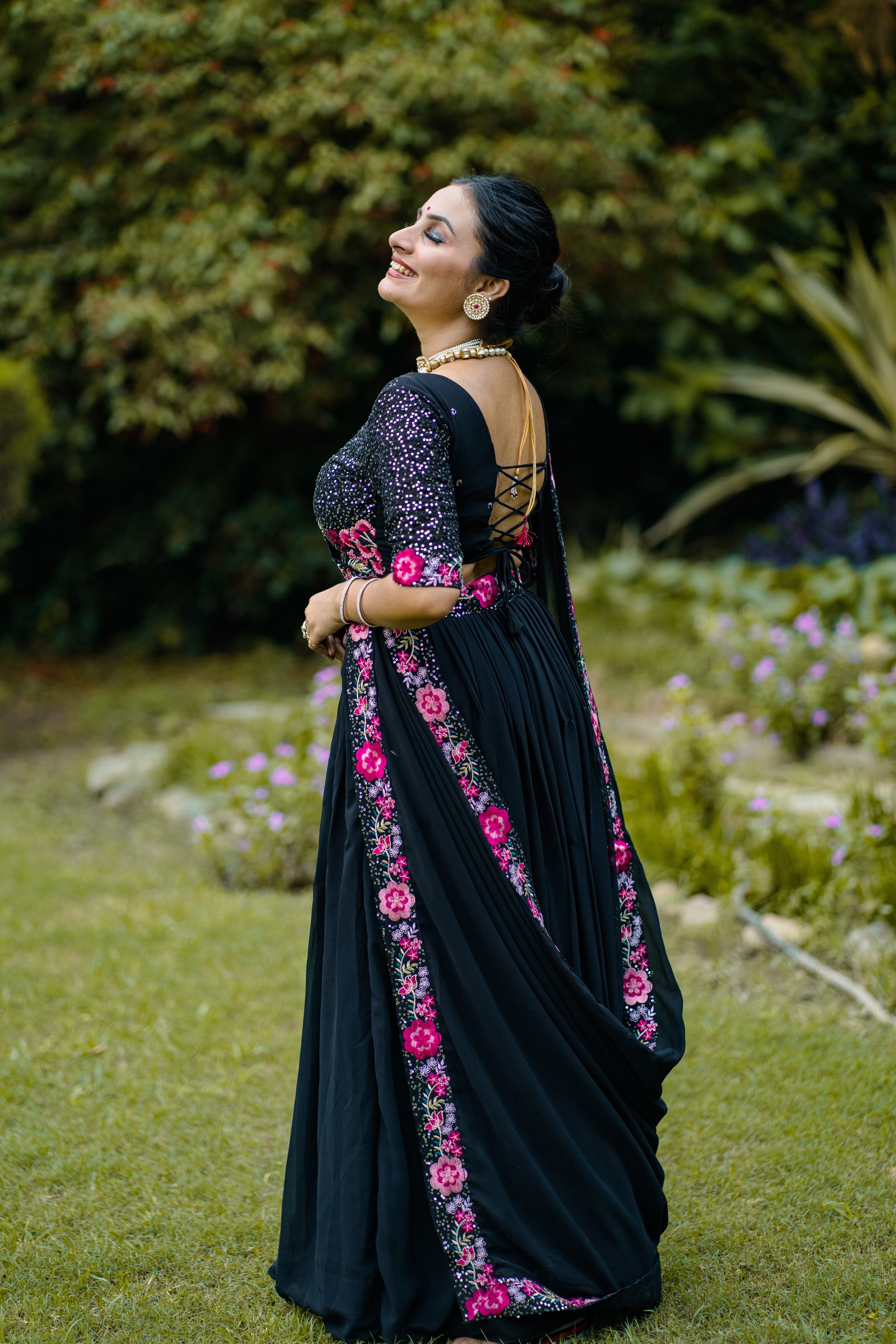 Elegant Black Lehenga Choli with Rani Pink Floral Embroidery