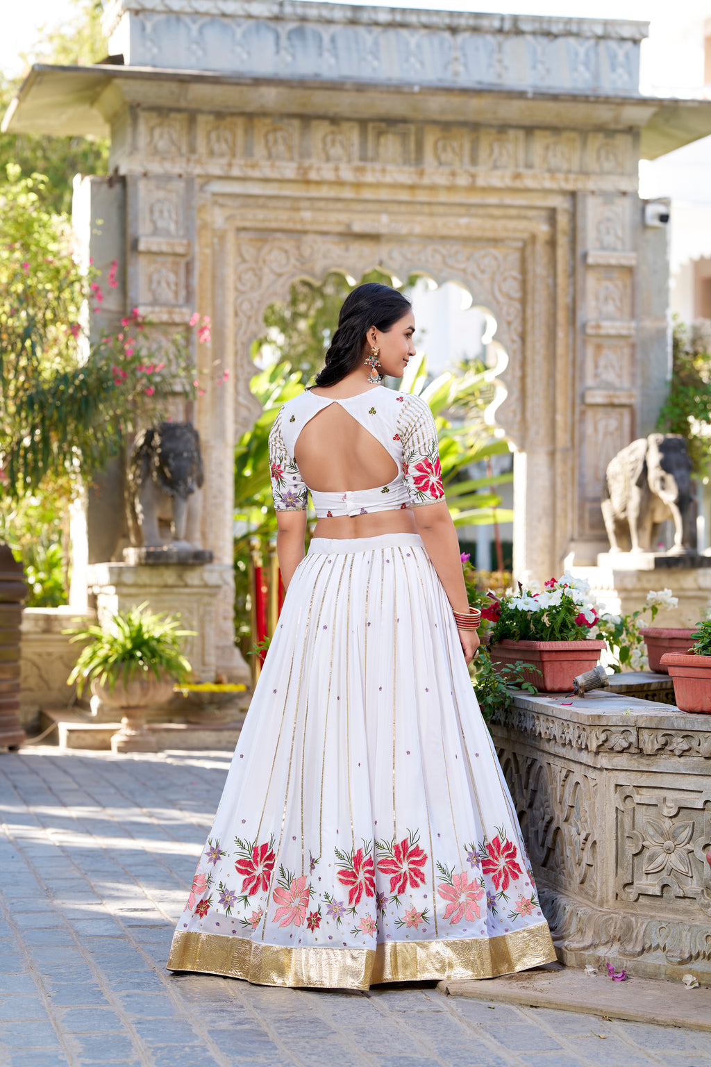 Serene White Lehenga with a Vibrant Floral Garden Print and Gold Border