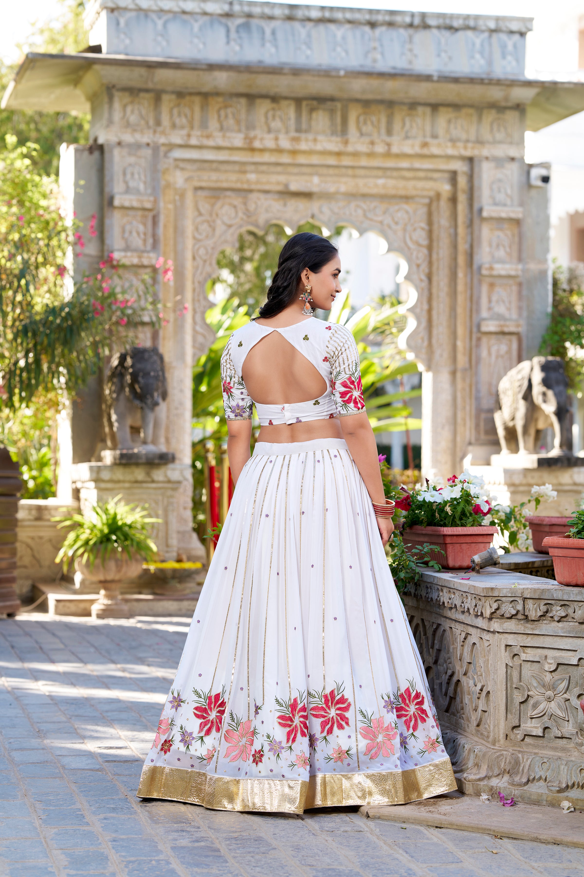 Serene White Lehenga with a Vibrant Floral Garden Print and Gold Border