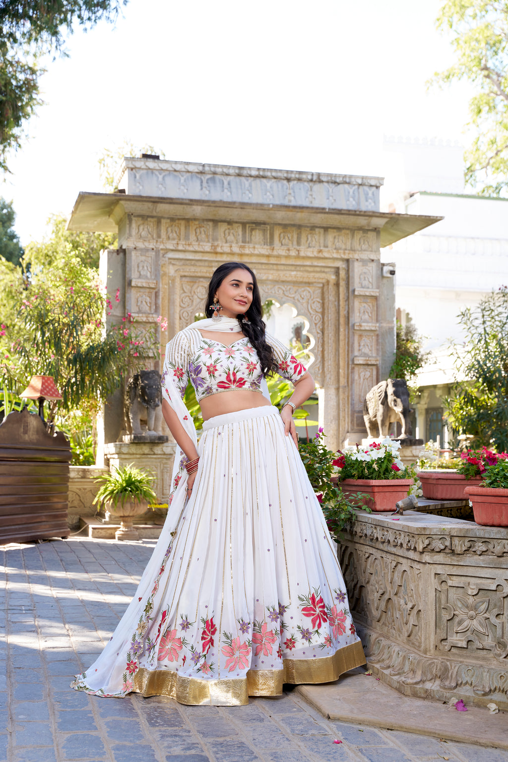 Serene White Lehenga with a Vibrant Floral Garden Print and Gold Border