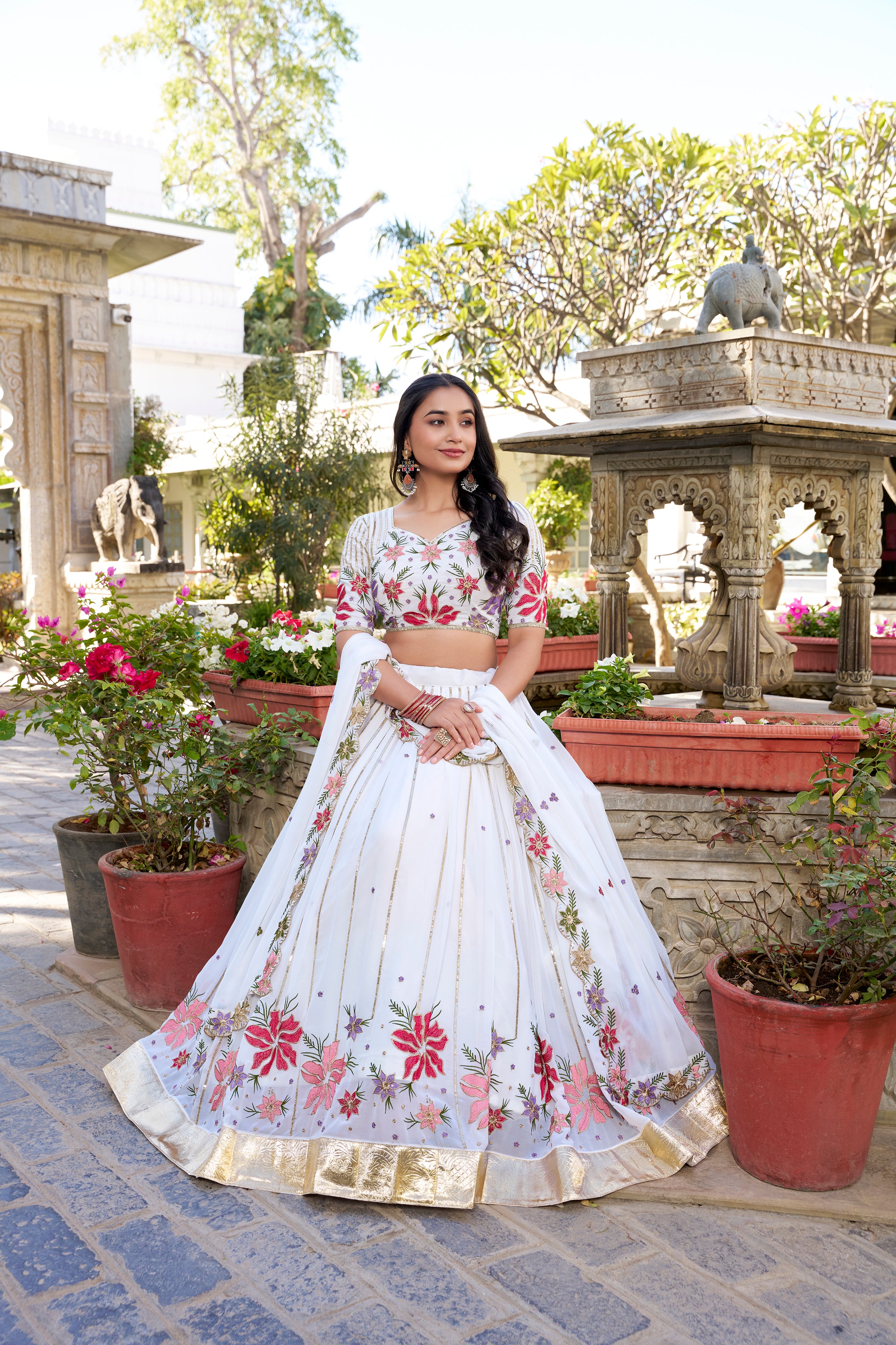Serene White Lehenga with a Vibrant Floral Garden Print and Gold Border