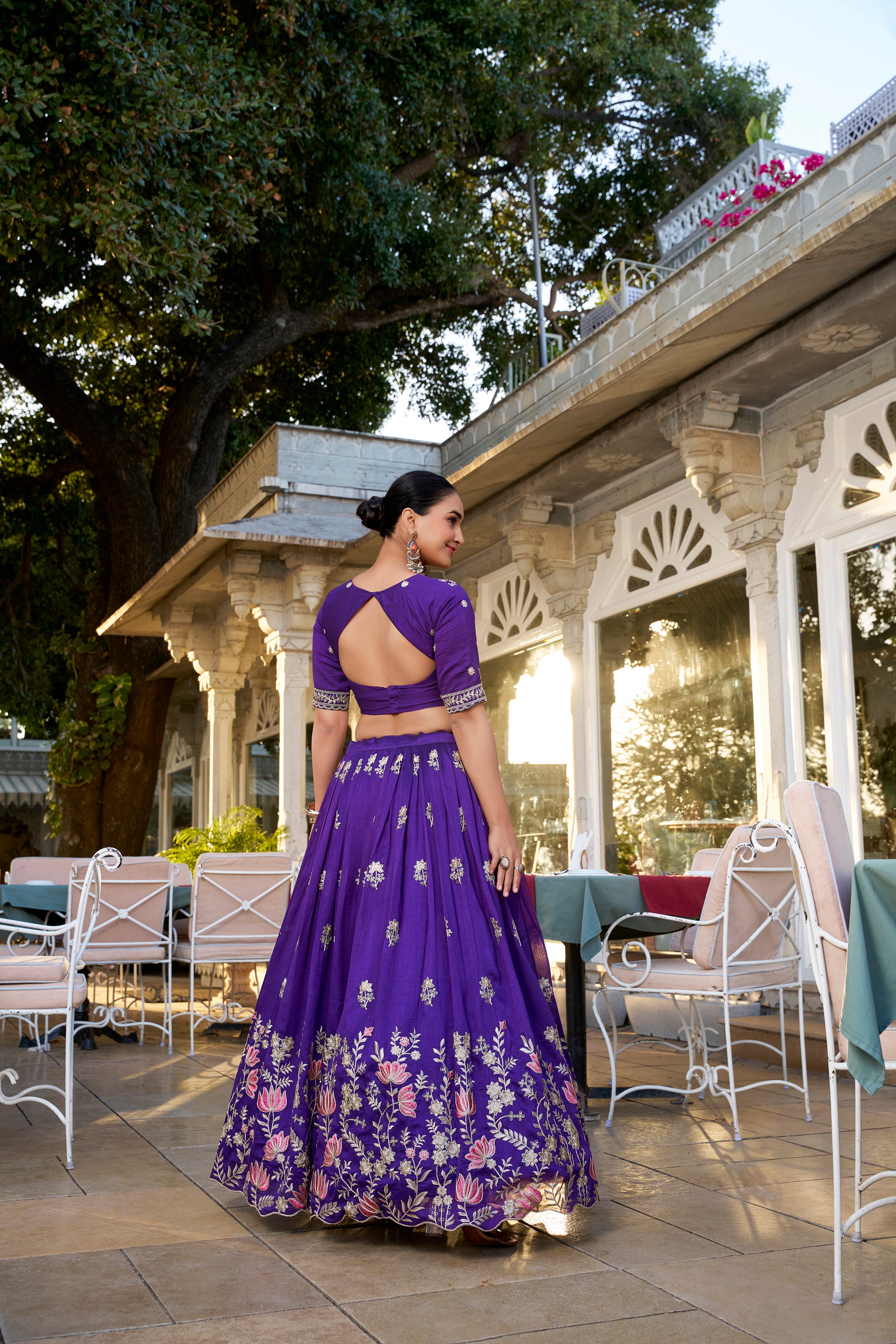 A vision of regal elegance in a vibrant purple and magenta lehenga.