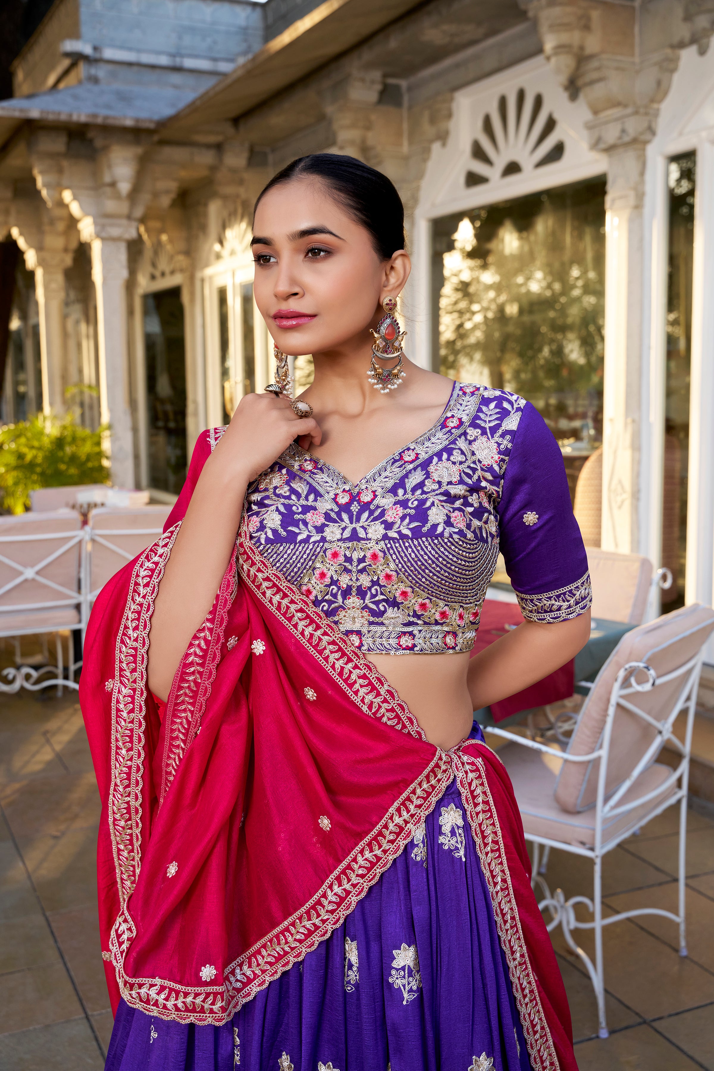 A vision of regal elegance in a vibrant purple and magenta lehenga.