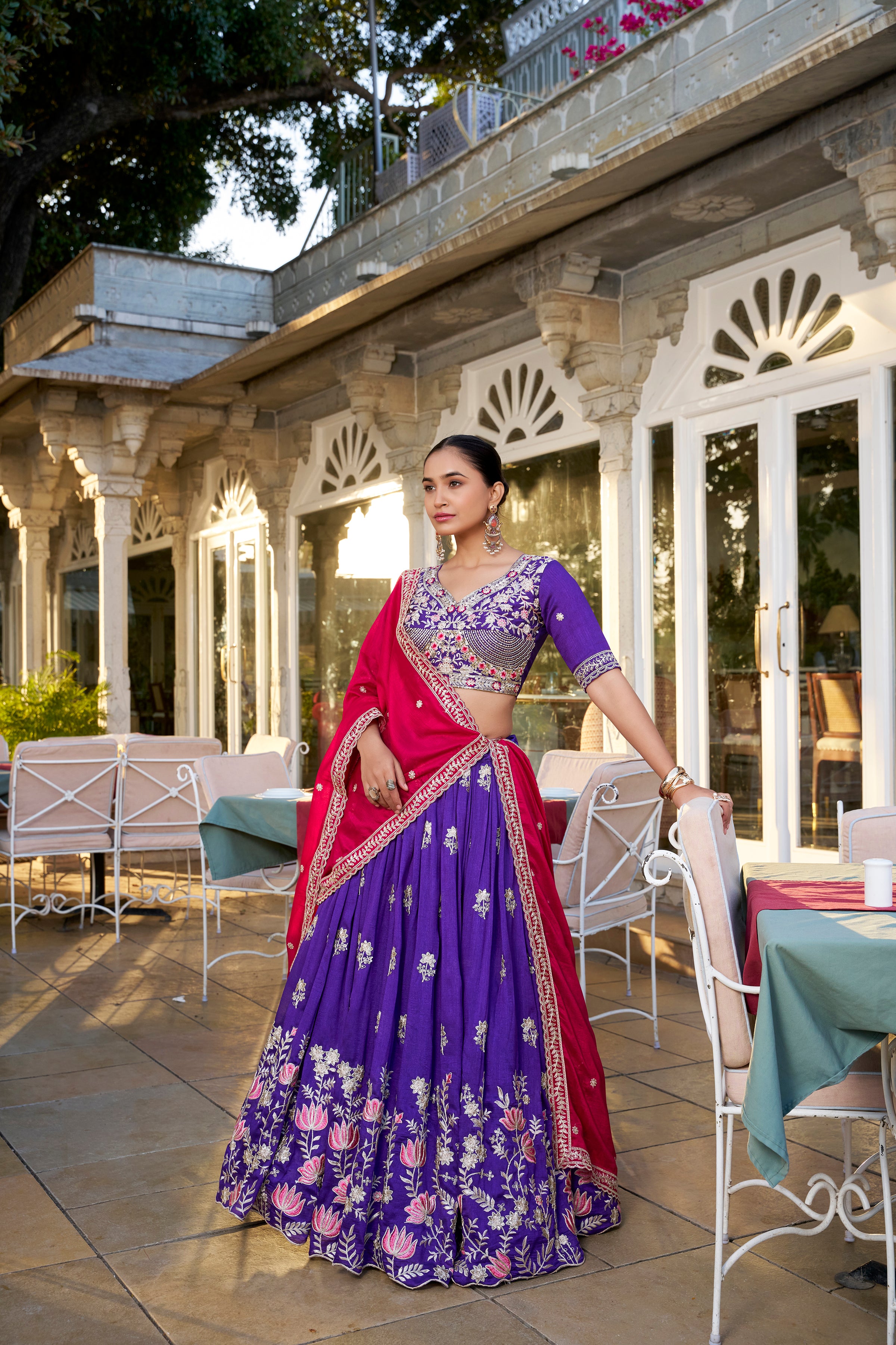 A vision of regal elegance in a vibrant purple and magenta lehenga.