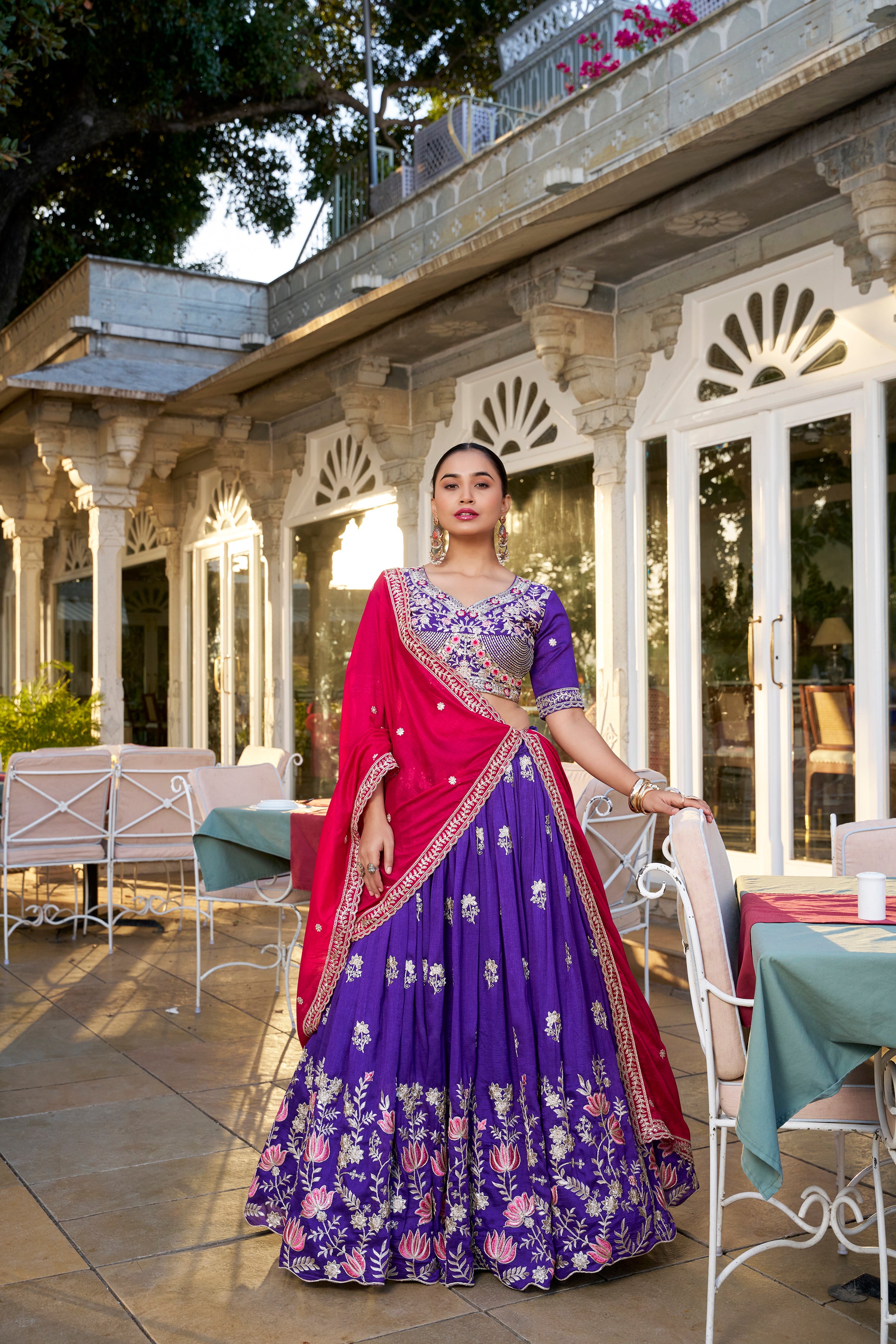 A vision of regal elegance in a vibrant purple and magenta lehenga.