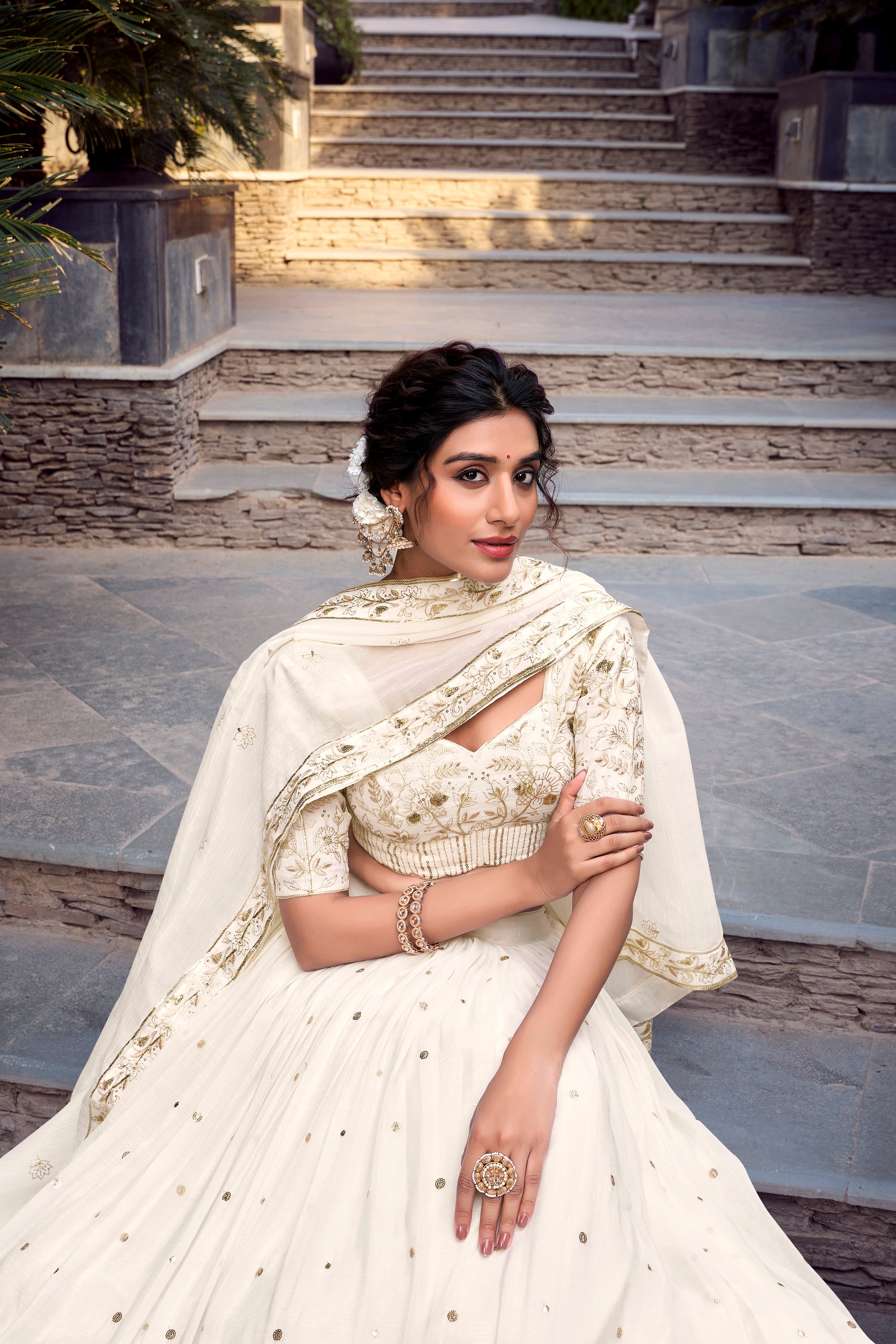 Graceful Off-White Lehenga Choli featuring Delicate Gold Floral Embroidery and a Broad Zari Border