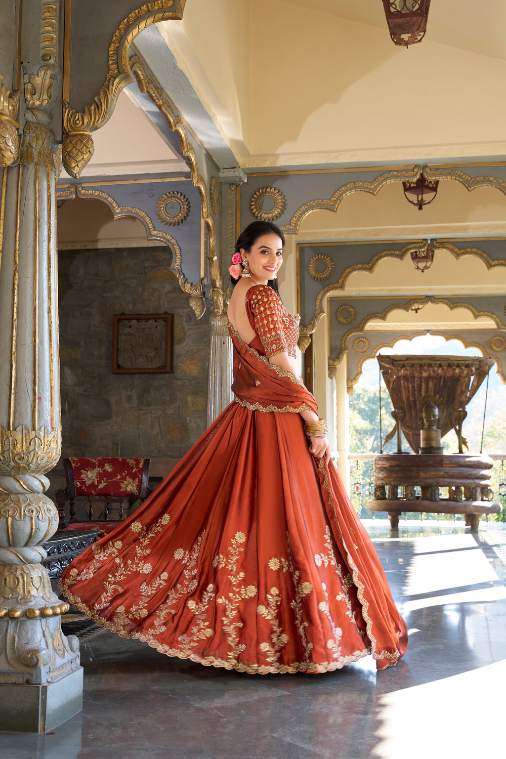 A vision of timeless elegance in a radiant rust-orange lehenga.