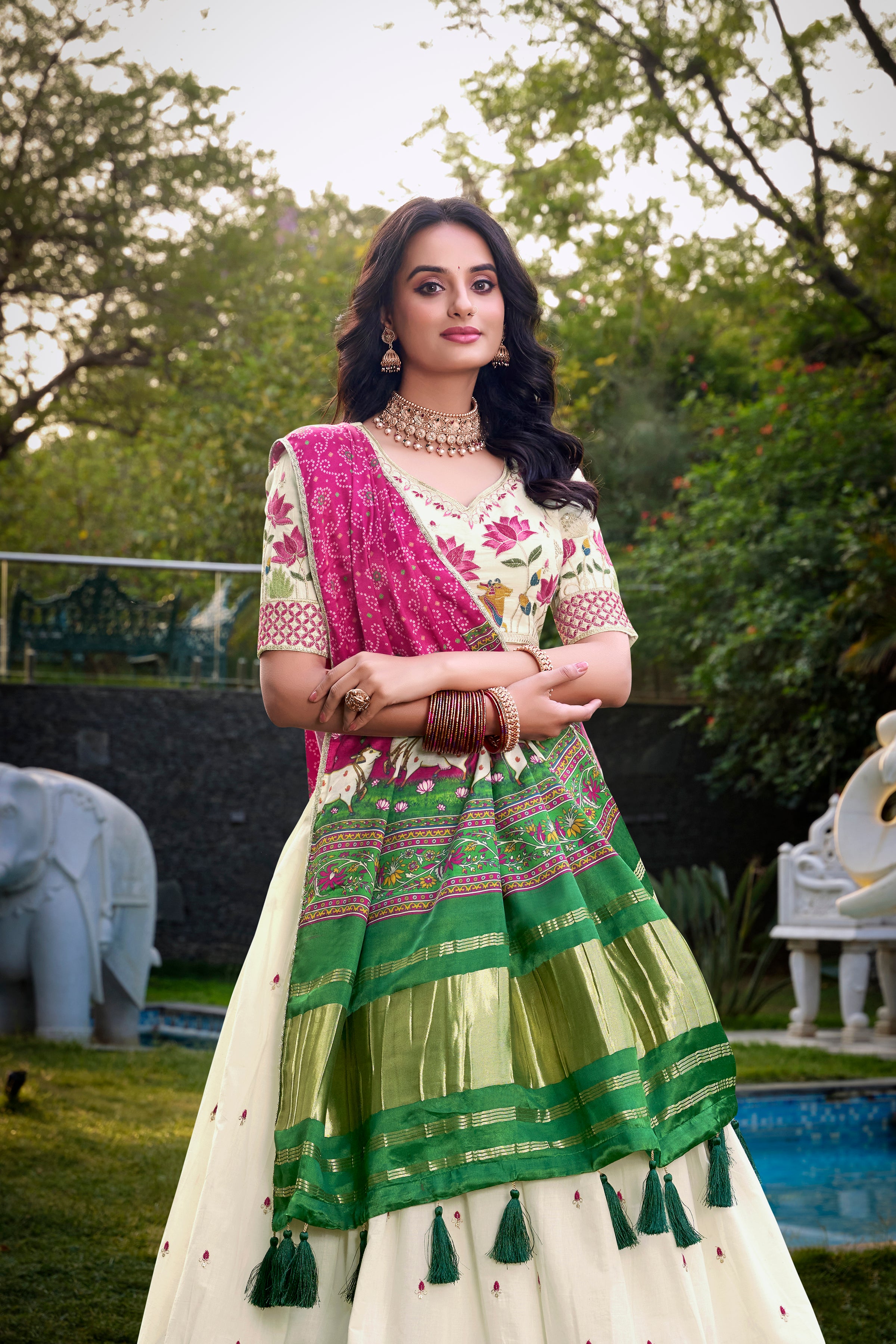 A vision of grace in an ivory lehenga adorned with peacock motifs.