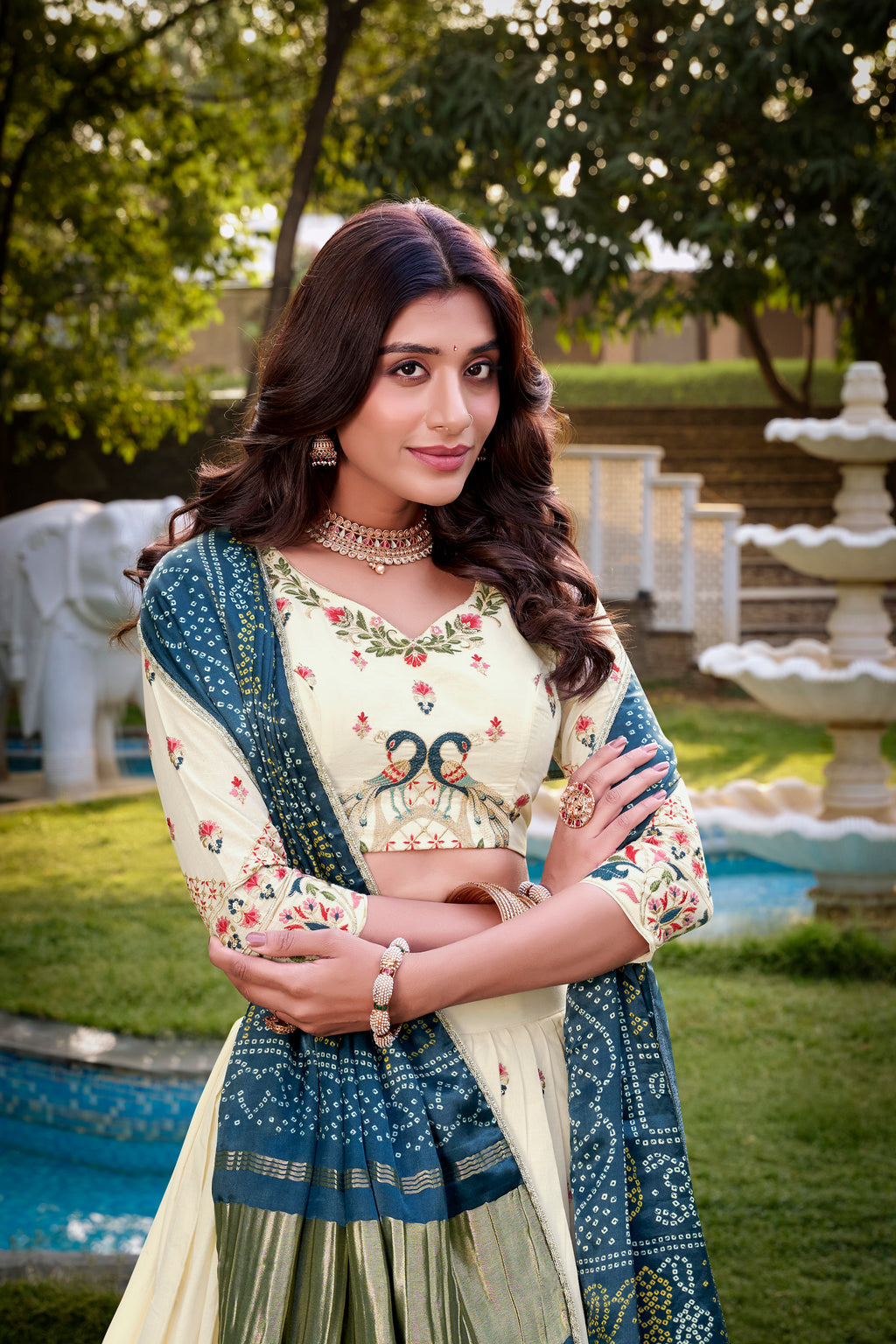 A vision of grace in an ivory lehenga adorned with peacock motifs.