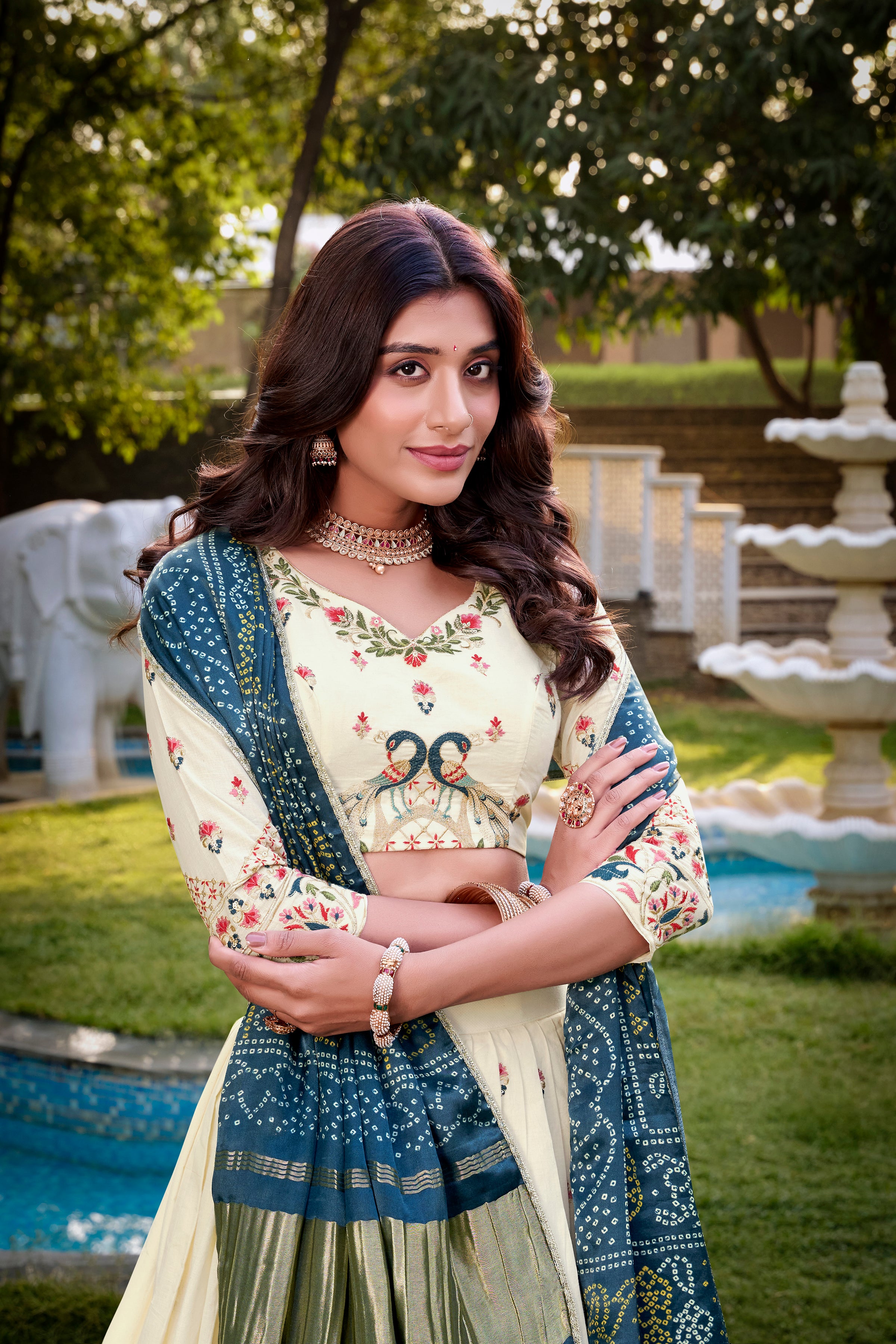 A vision of grace in an ivory lehenga adorned with peacock motifs.
