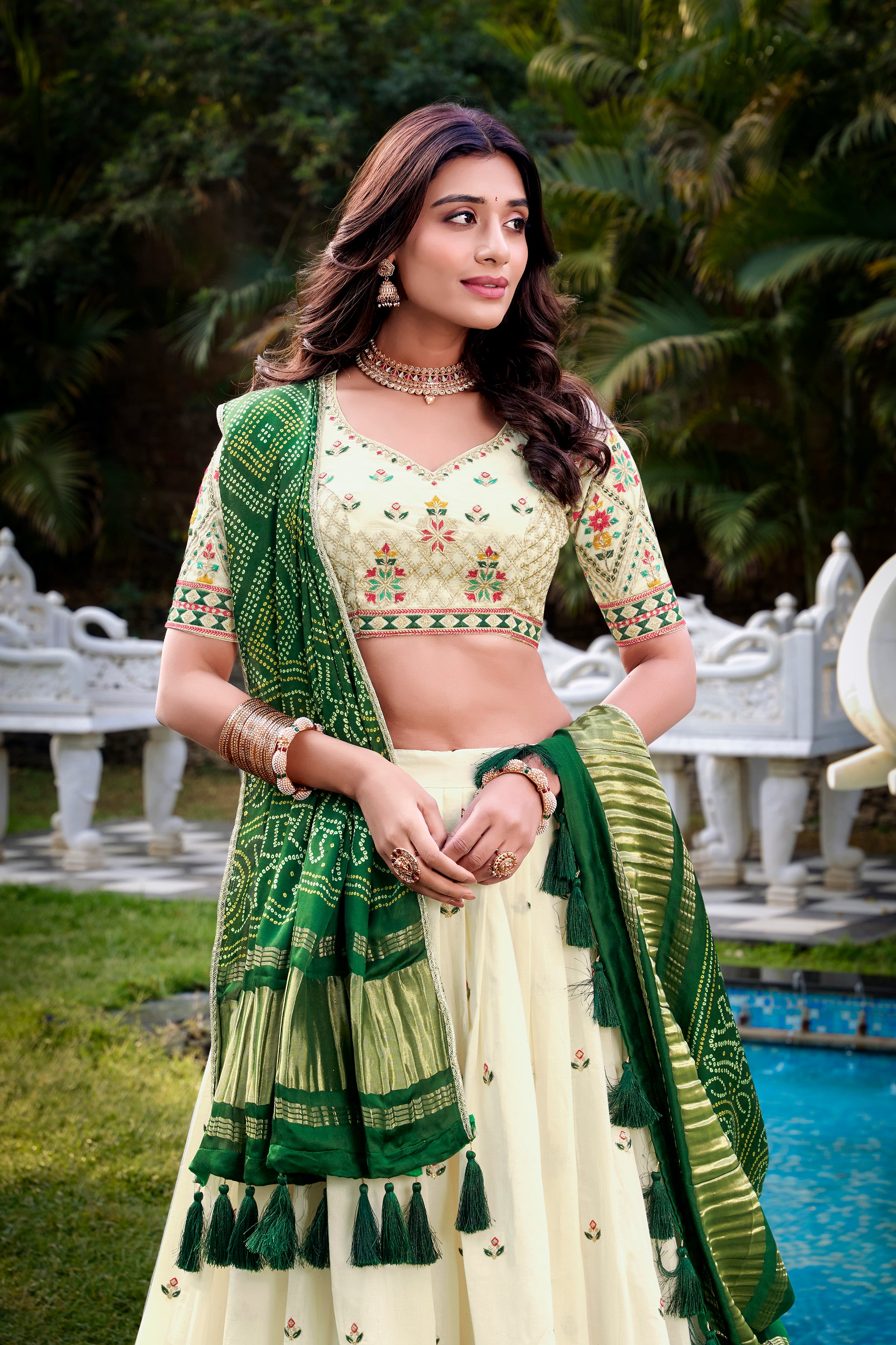 A vision of grace in an ivory lehenga adorned with peacock motifs.