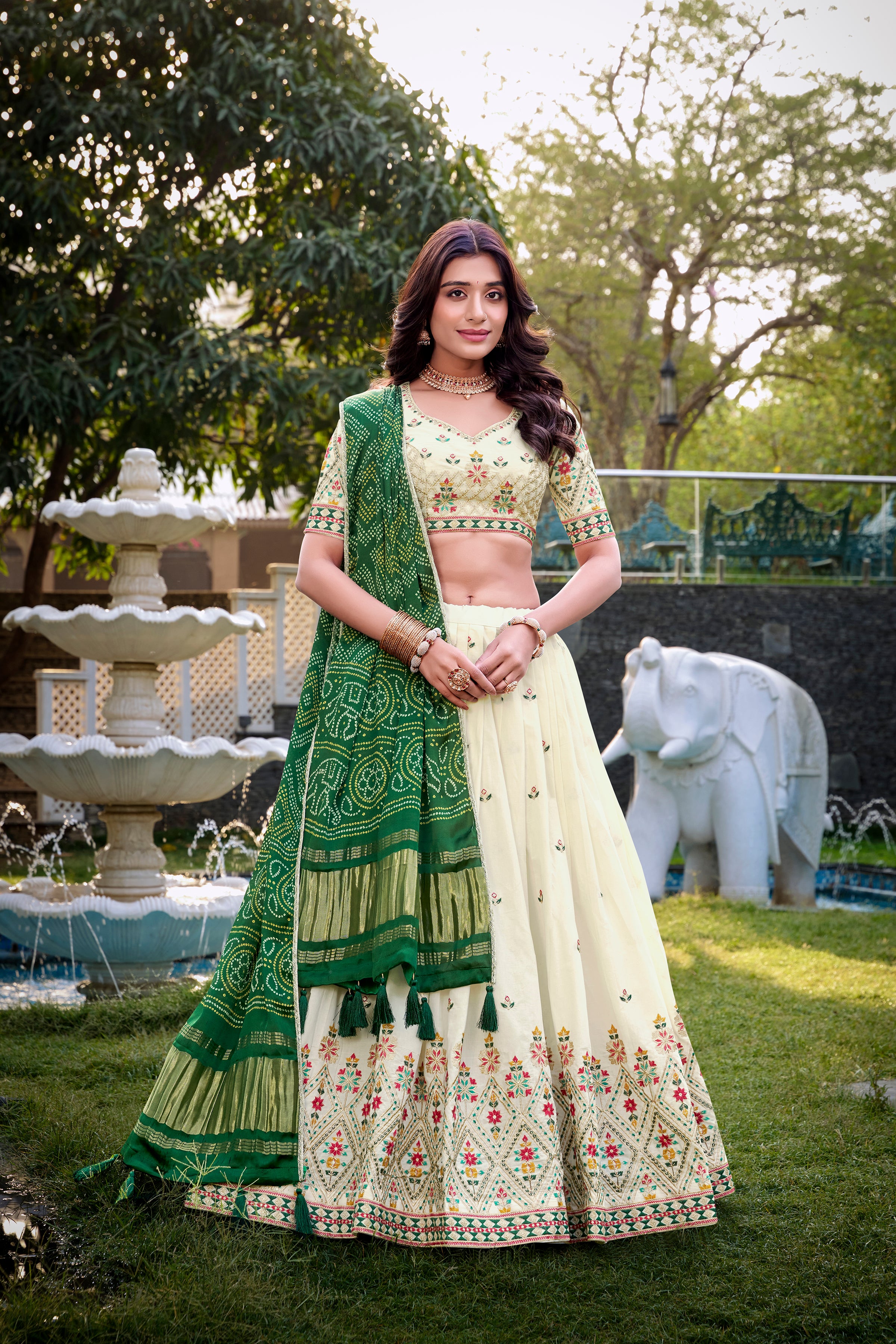 A vision of grace in an ivory lehenga adorned with peacock motifs.