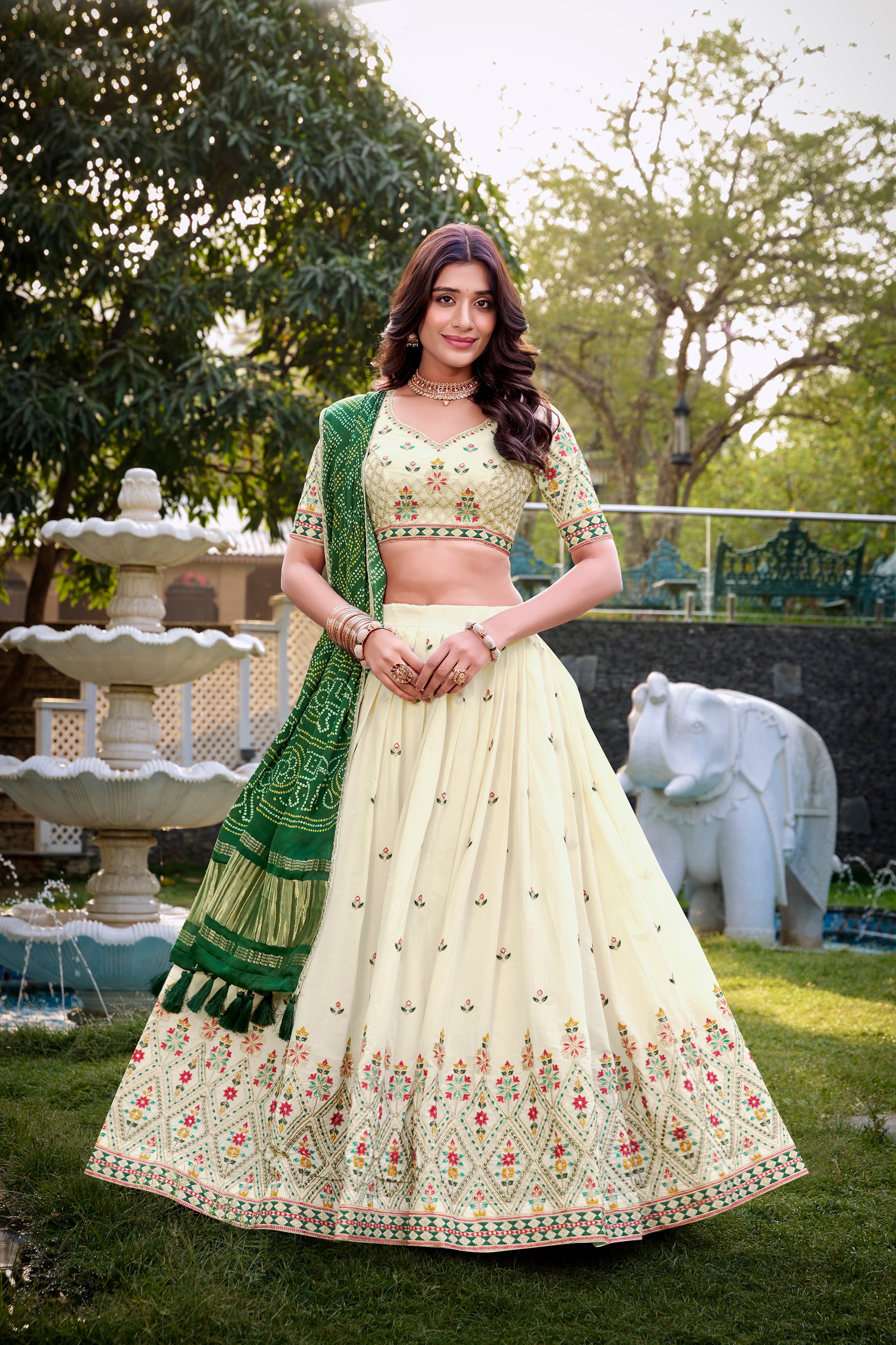 A vision of grace in an ivory lehenga adorned with peacock motifs.