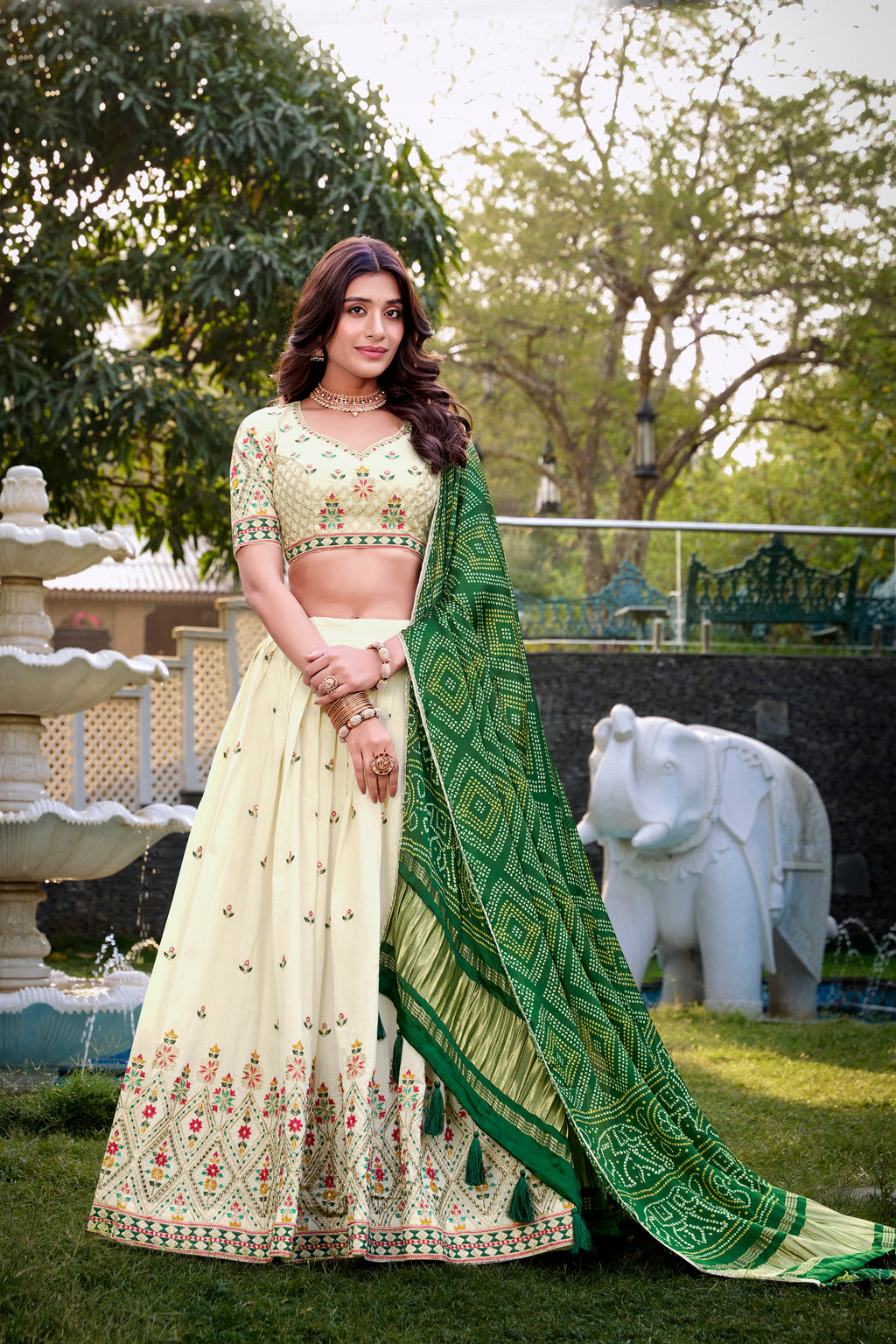 A vision of grace in an ivory lehenga adorned with peacock motifs.