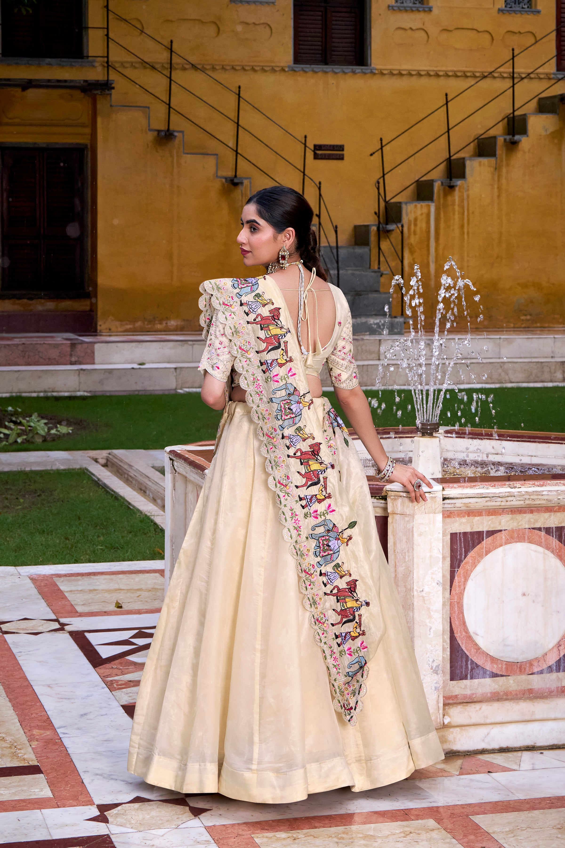 Elegant Cream Lehenga with a Hand-Embroidered Baraat Dupatta