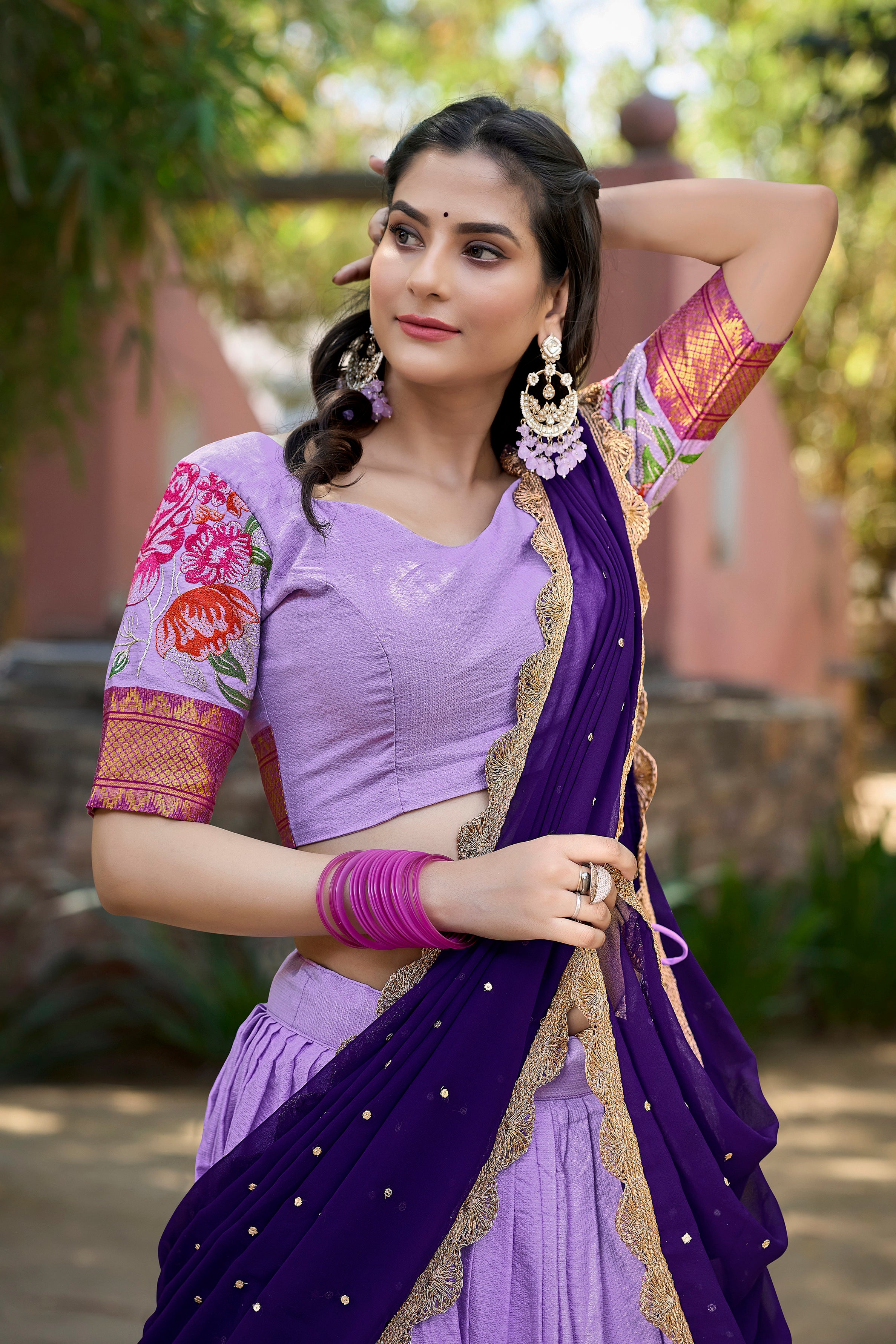 A vision of traditional grace in a floral lavender and purple lehenga.