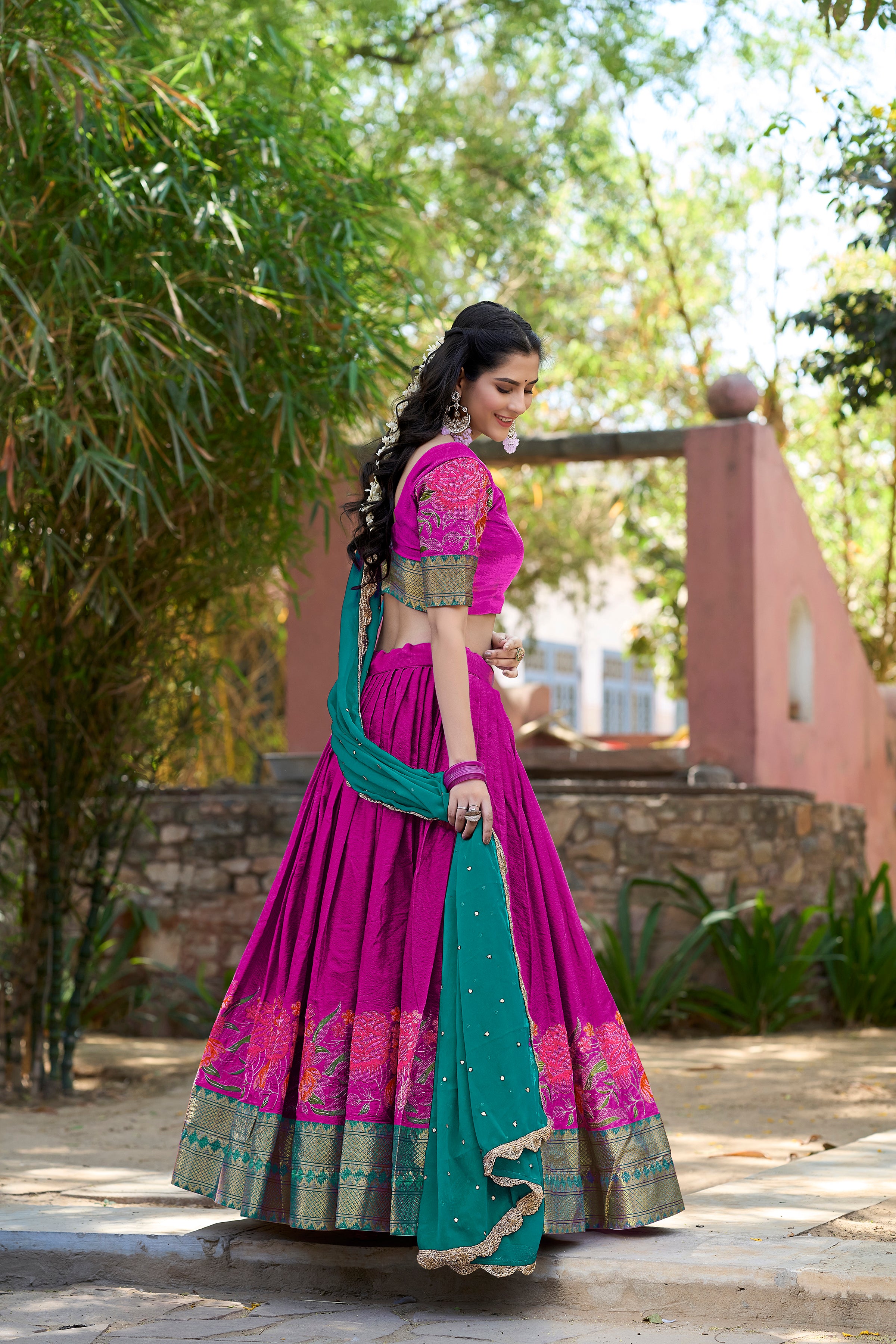 A vision of traditional grace in a floral lavender and purple lehenga.