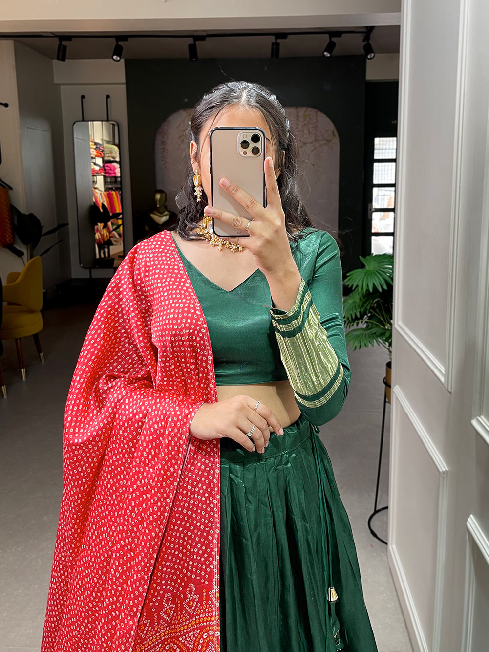 Elegant green lehenga with a vibrant coral dupatta