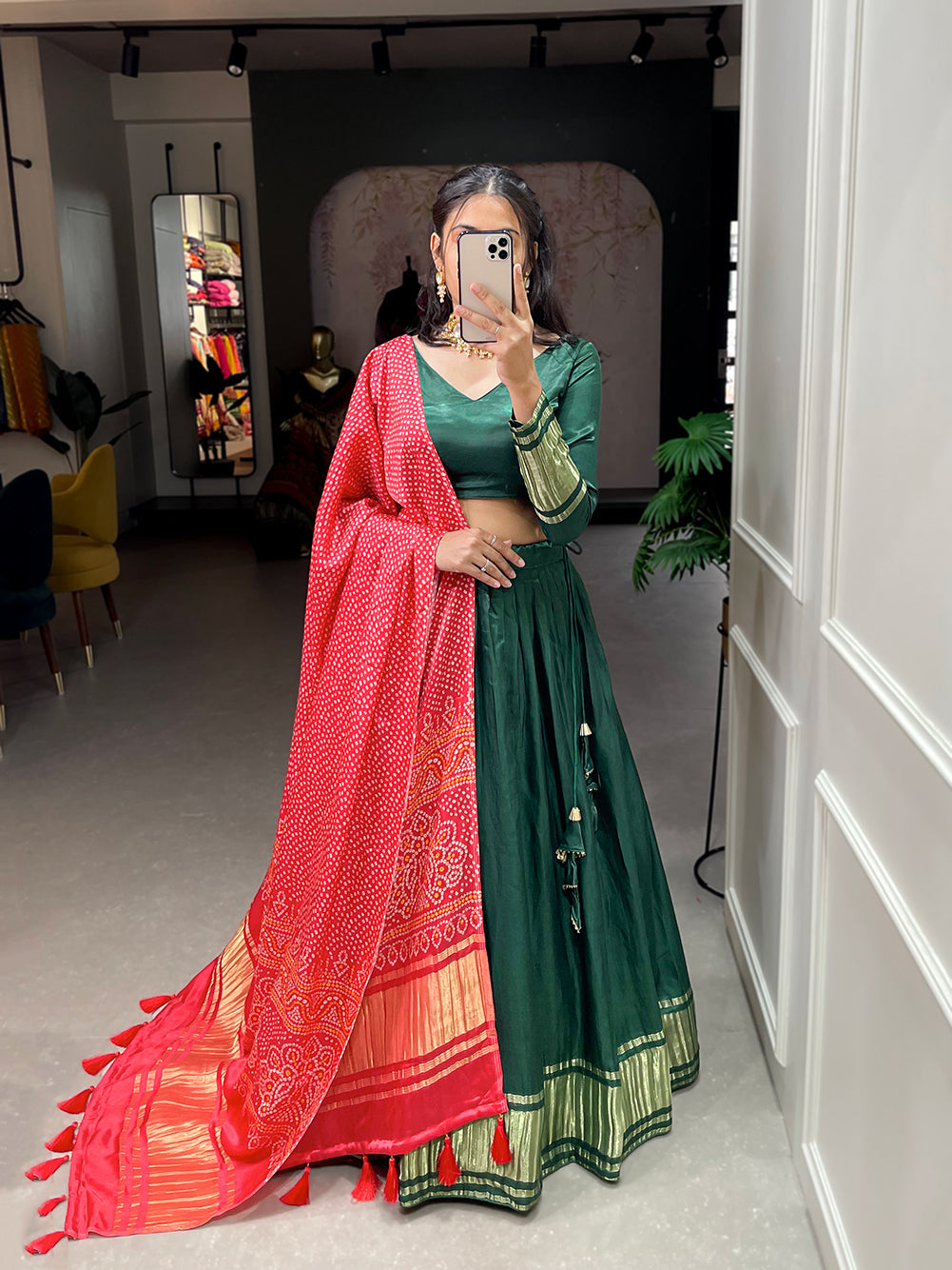 Elegant green lehenga with a vibrant coral dupatta