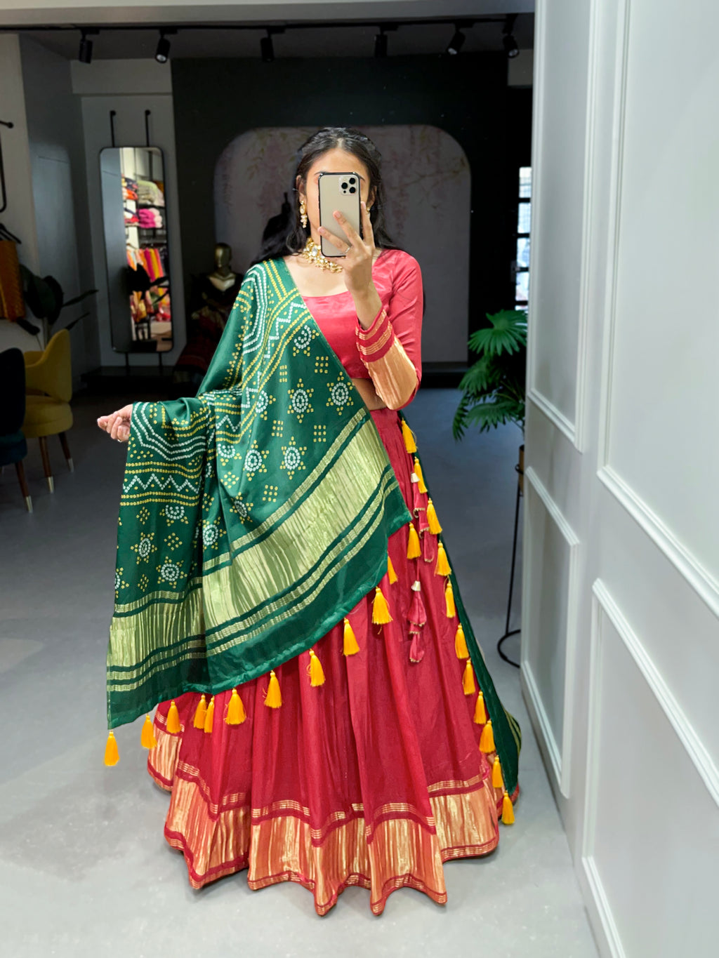 Elegant green lehenga with a vibrant coral dupatta