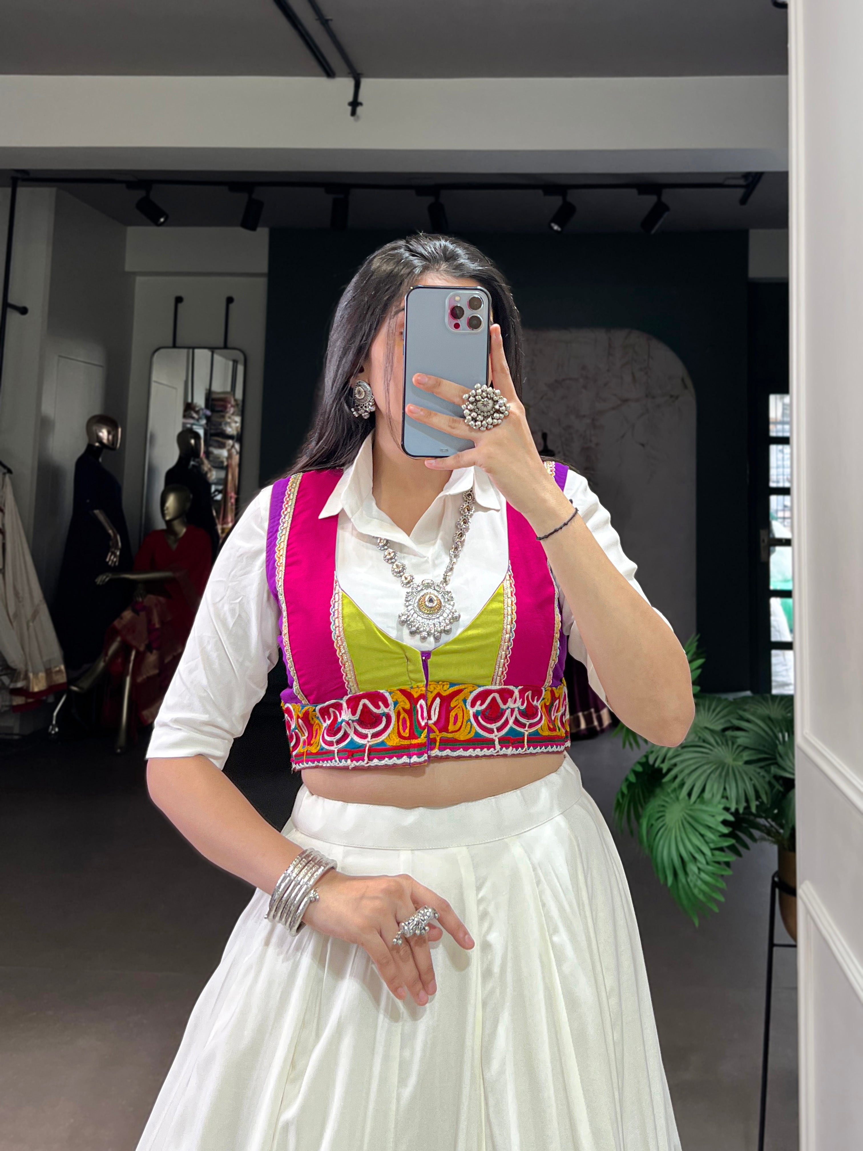 Designer White Lehenga Paired with Colorful Blouse and Border Detailing