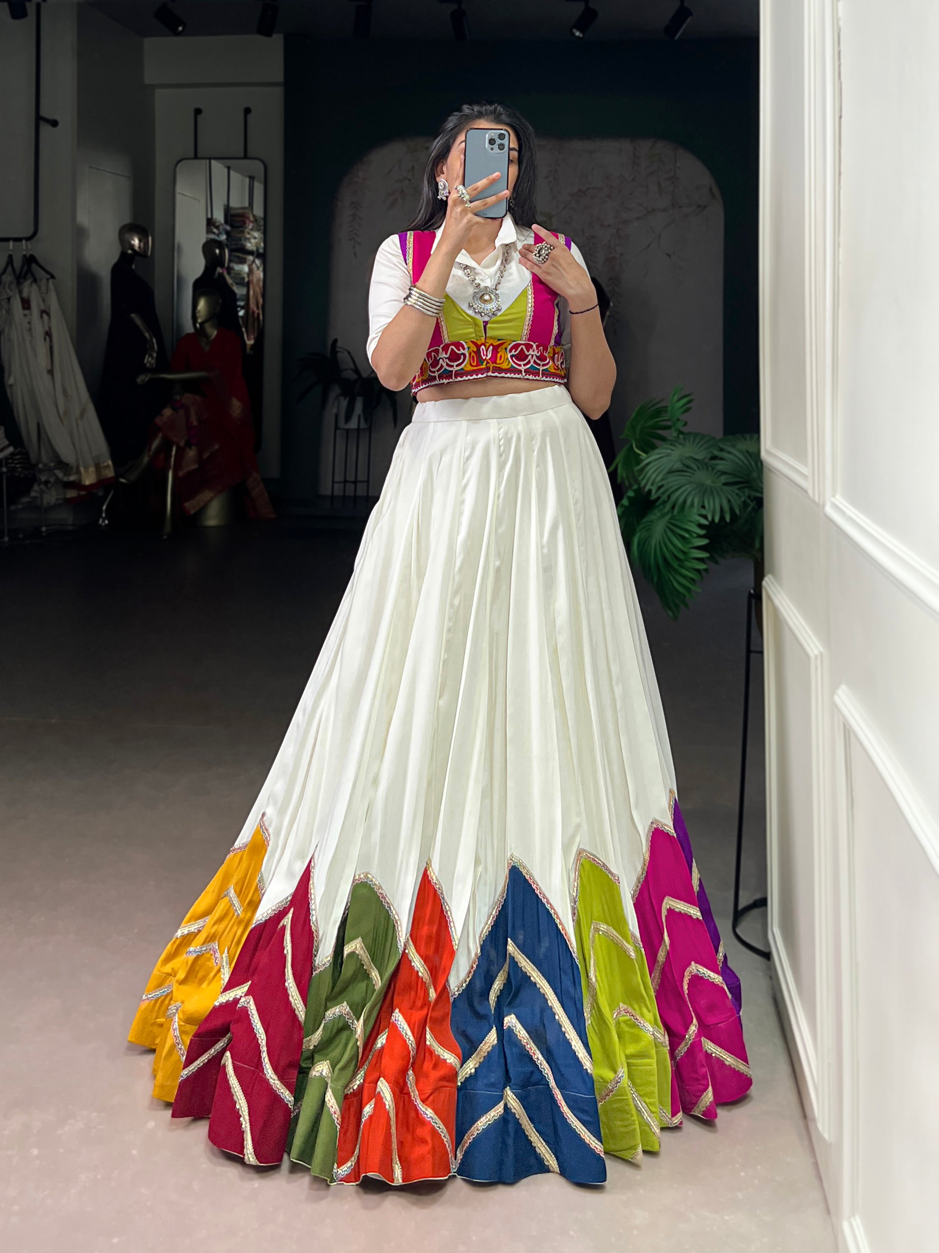 Designer White Lehenga Paired with Colorful Blouse and Border Detailing