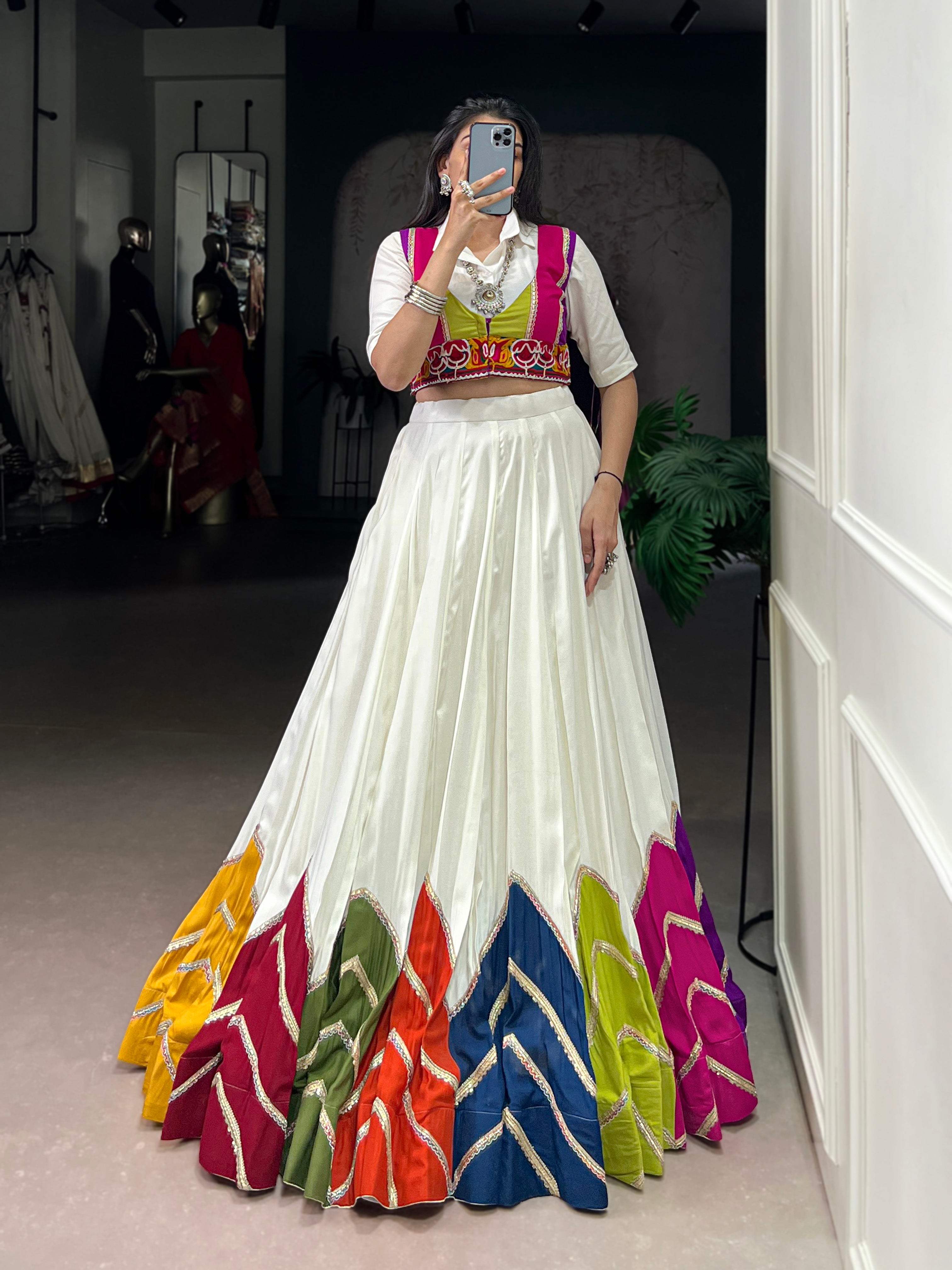 Designer White Lehenga Paired with Colorful Blouse and Border Detailing