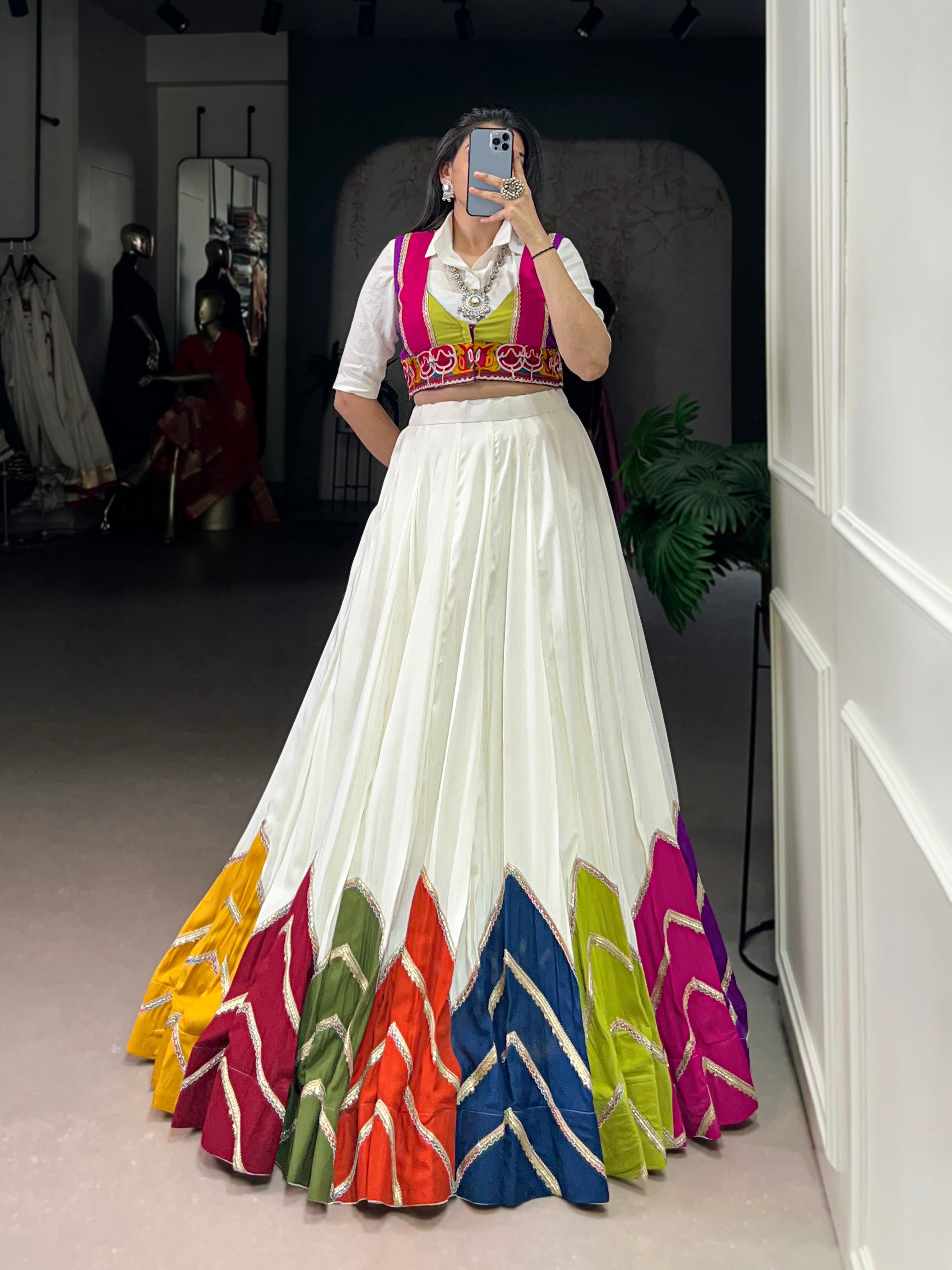 Designer White Lehenga Paired with Colorful Blouse and Border Detailing