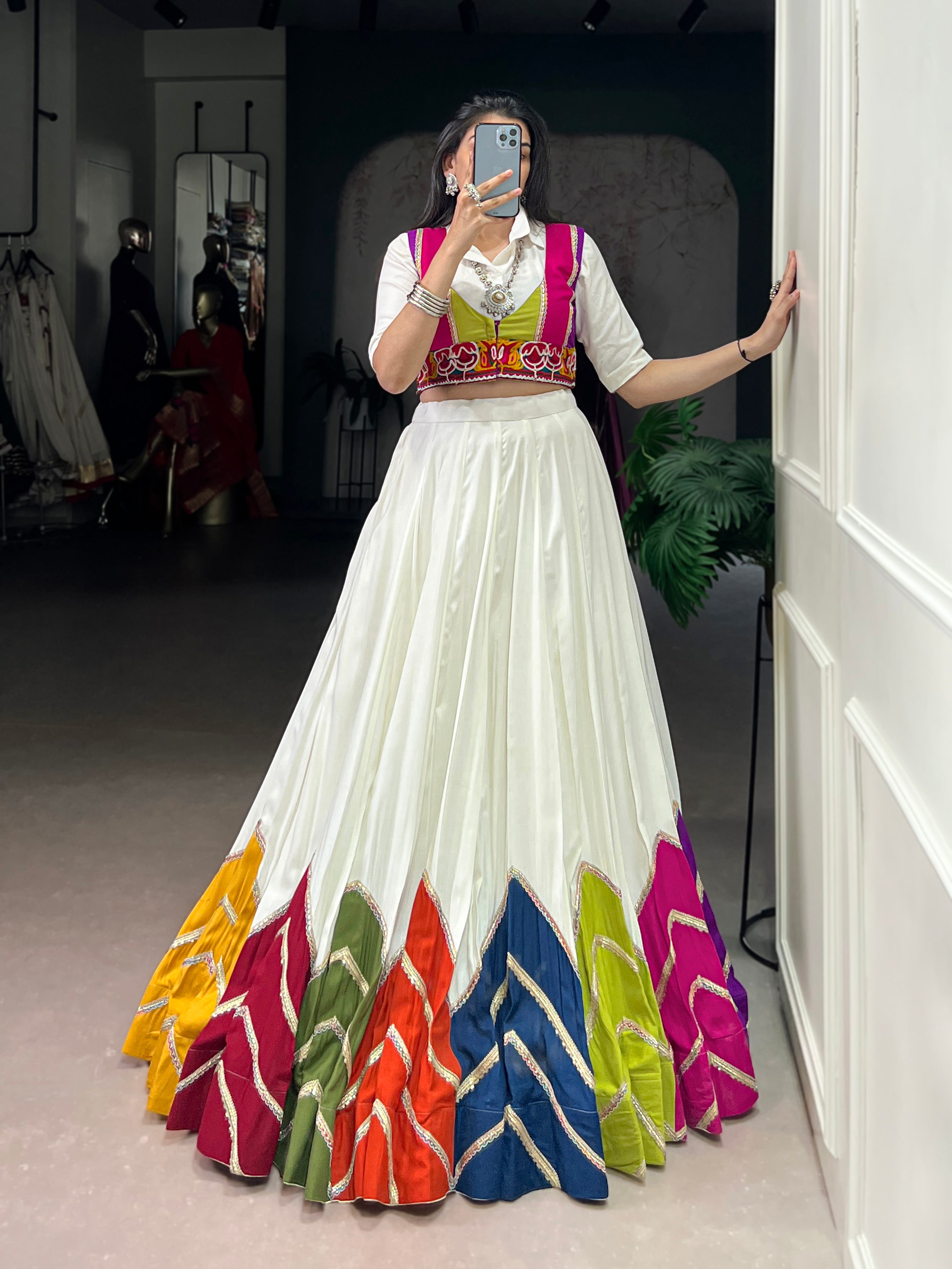 Designer White Lehenga Paired with Colorful Blouse and Border Detailing