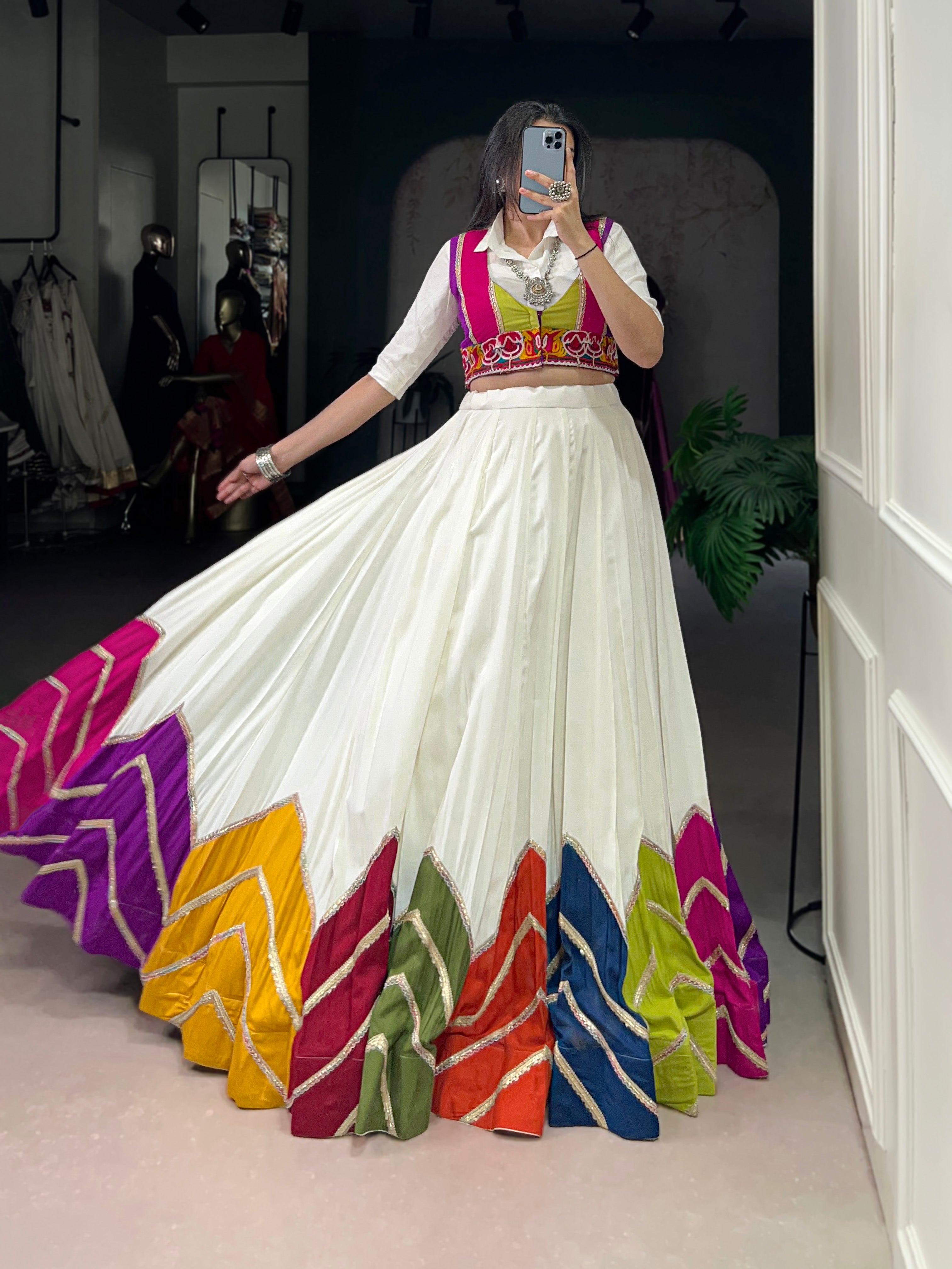 Designer White Lehenga Paired with Colorful Blouse and Border Detailing