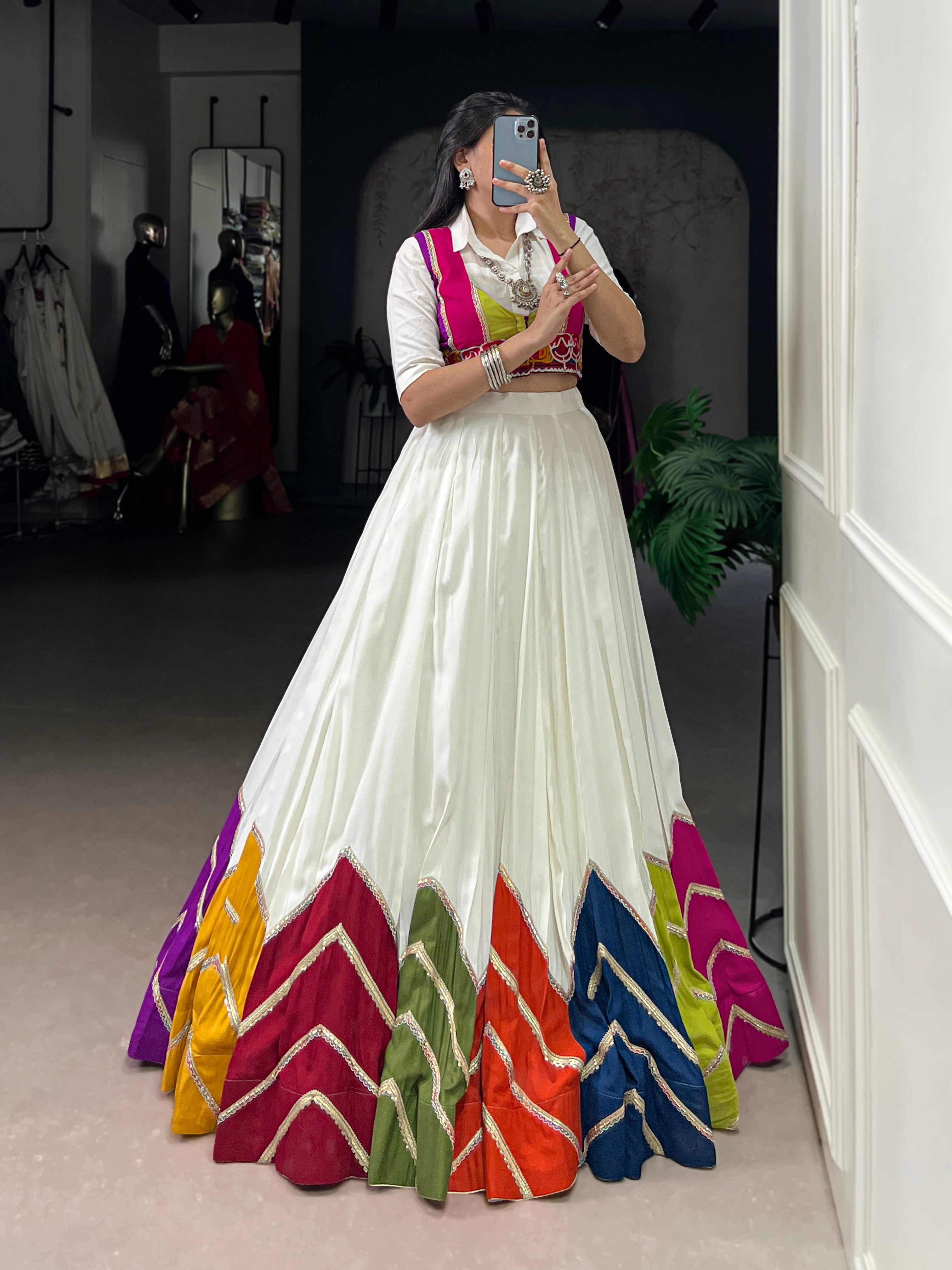 Designer White Lehenga Paired with Colorful Blouse and Border Detailing