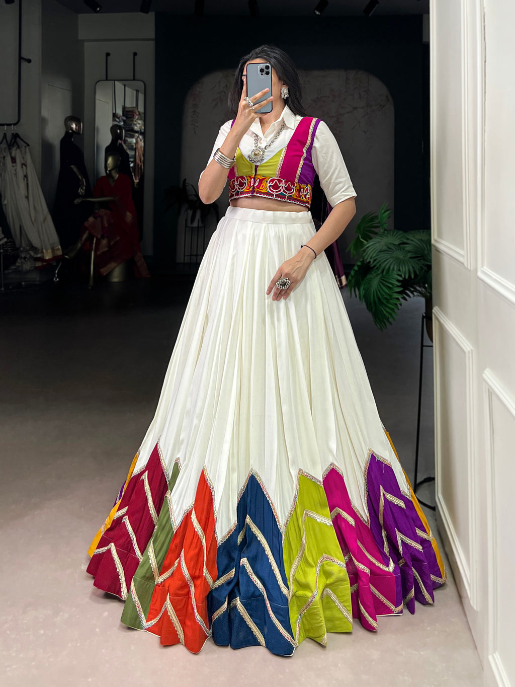 Designer White Lehenga Paired with Colorful Blouse and Border Detailing