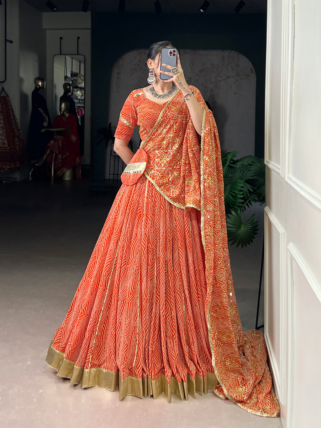 Bandhej-inspired lehenga with golden lace detailing