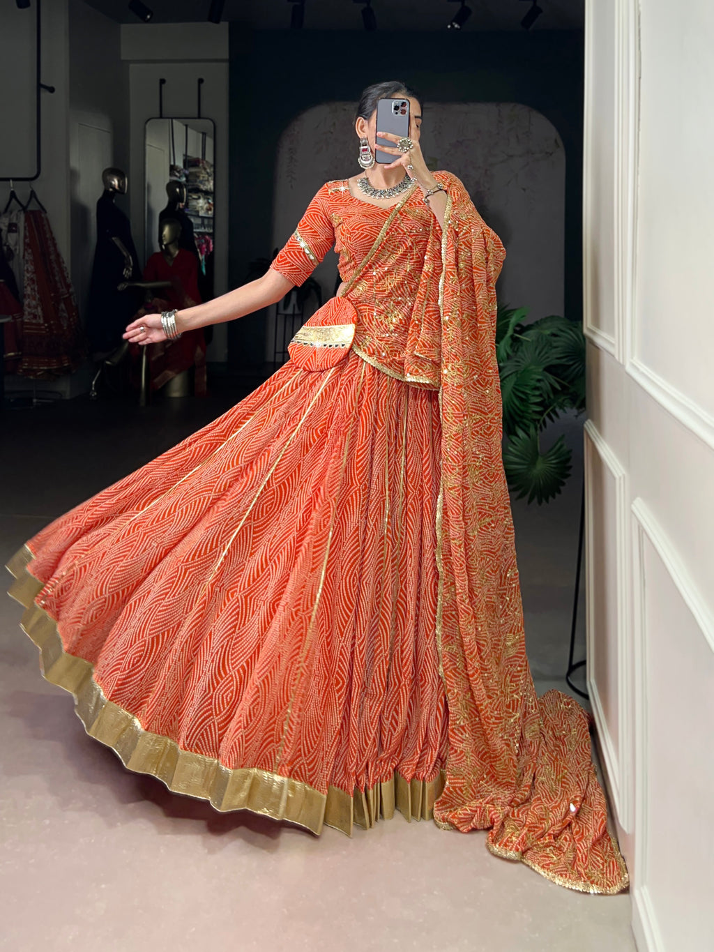 Bandhej-inspired lehenga with golden lace detailing