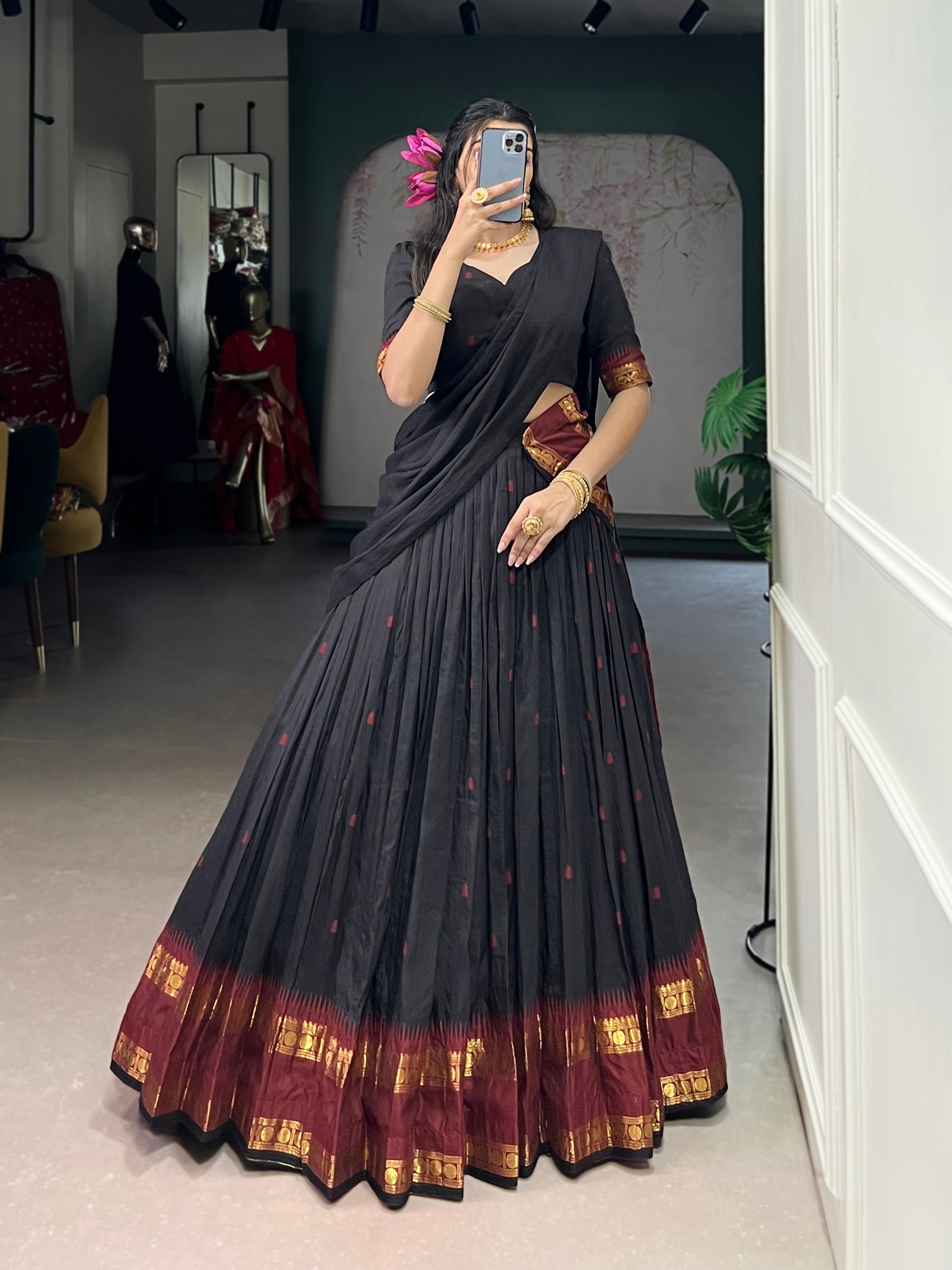 Classic maroon lehenga with a traditional green border