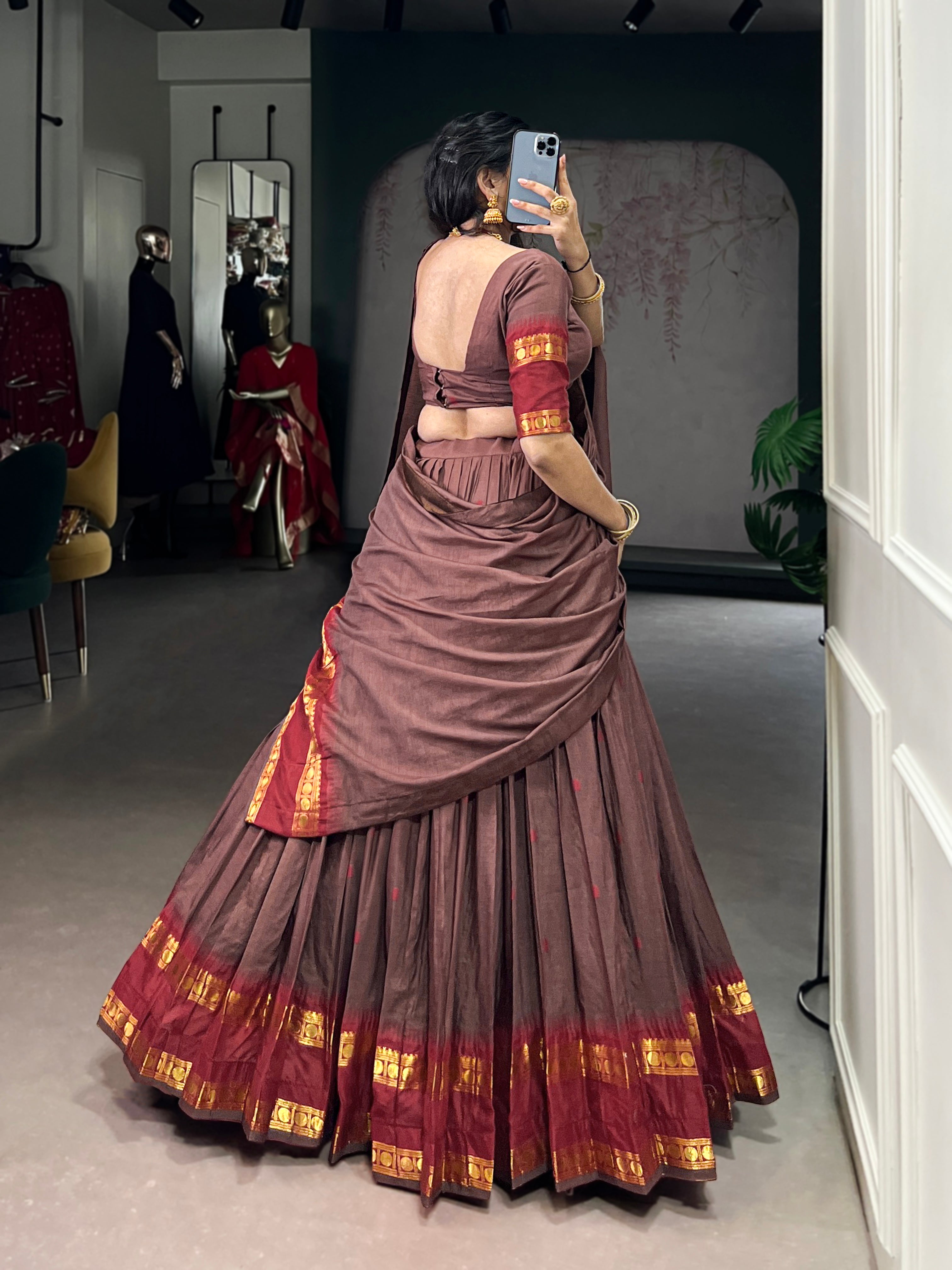 Classic maroon lehenga with a traditional green border