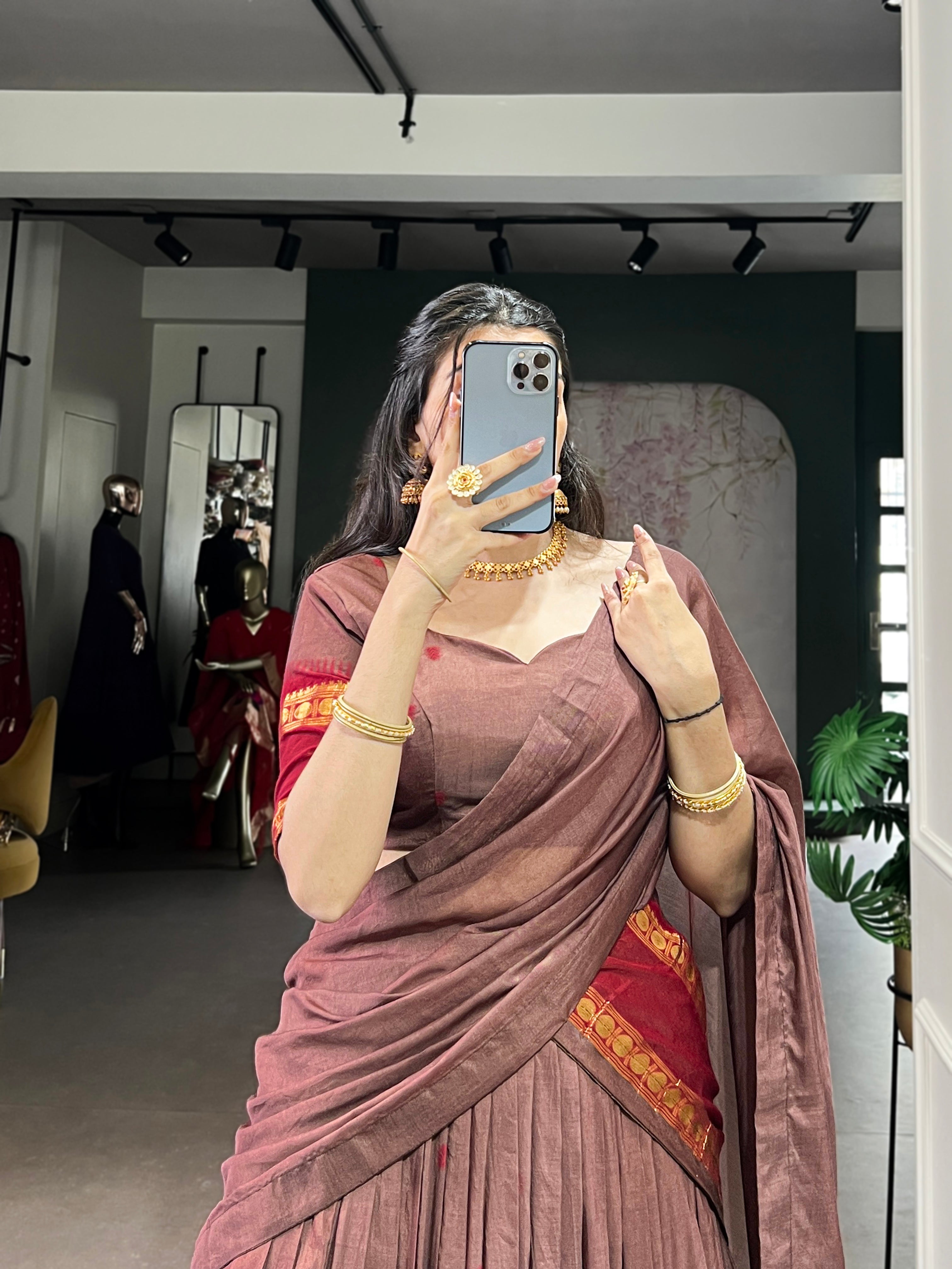 Classic maroon lehenga with a traditional green border